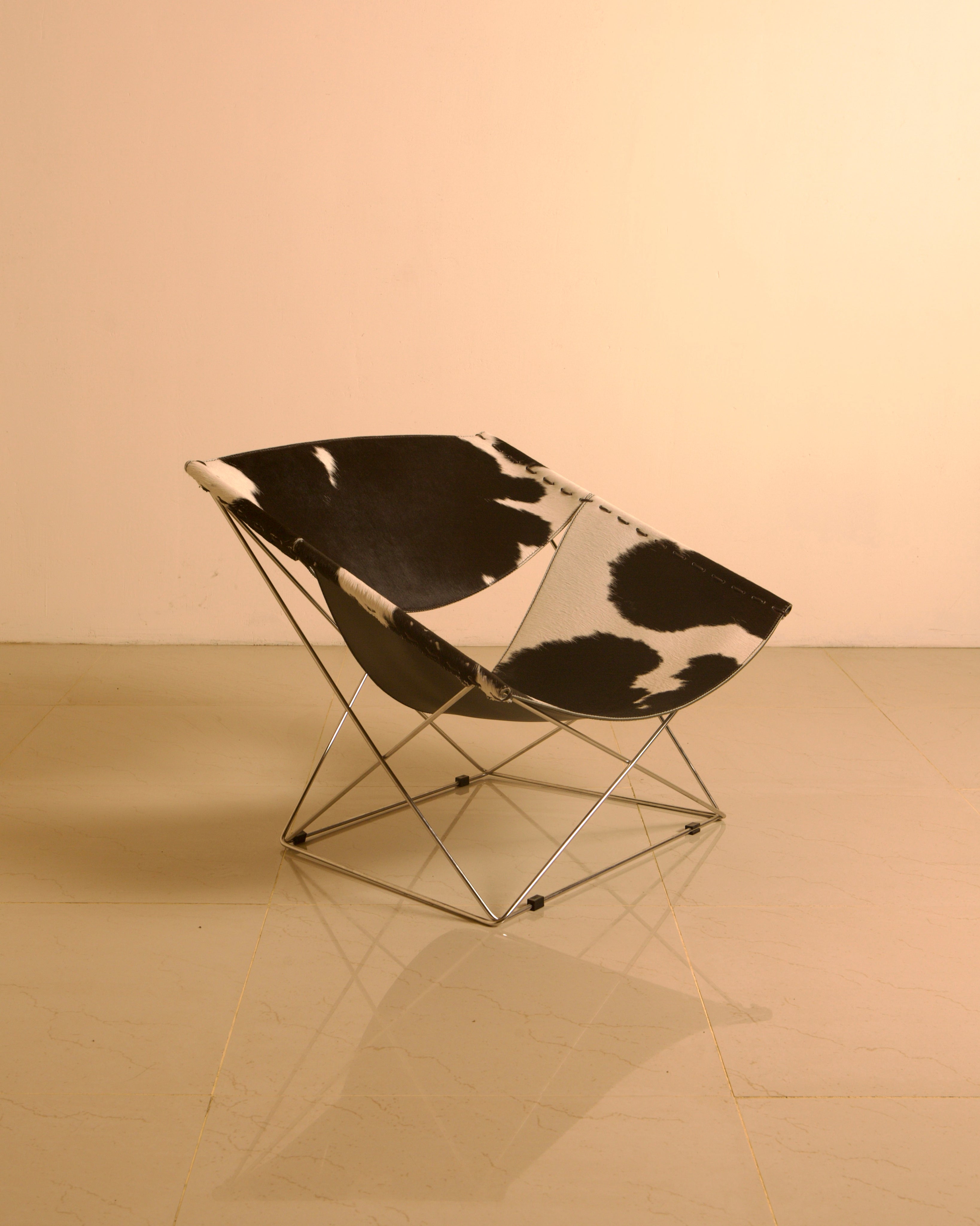 F675 "Butterfly" Cowhide Armchair by Pierre Paulin for Artifort 00's by Treaptyque | The Oblist — cowhide material, modern de