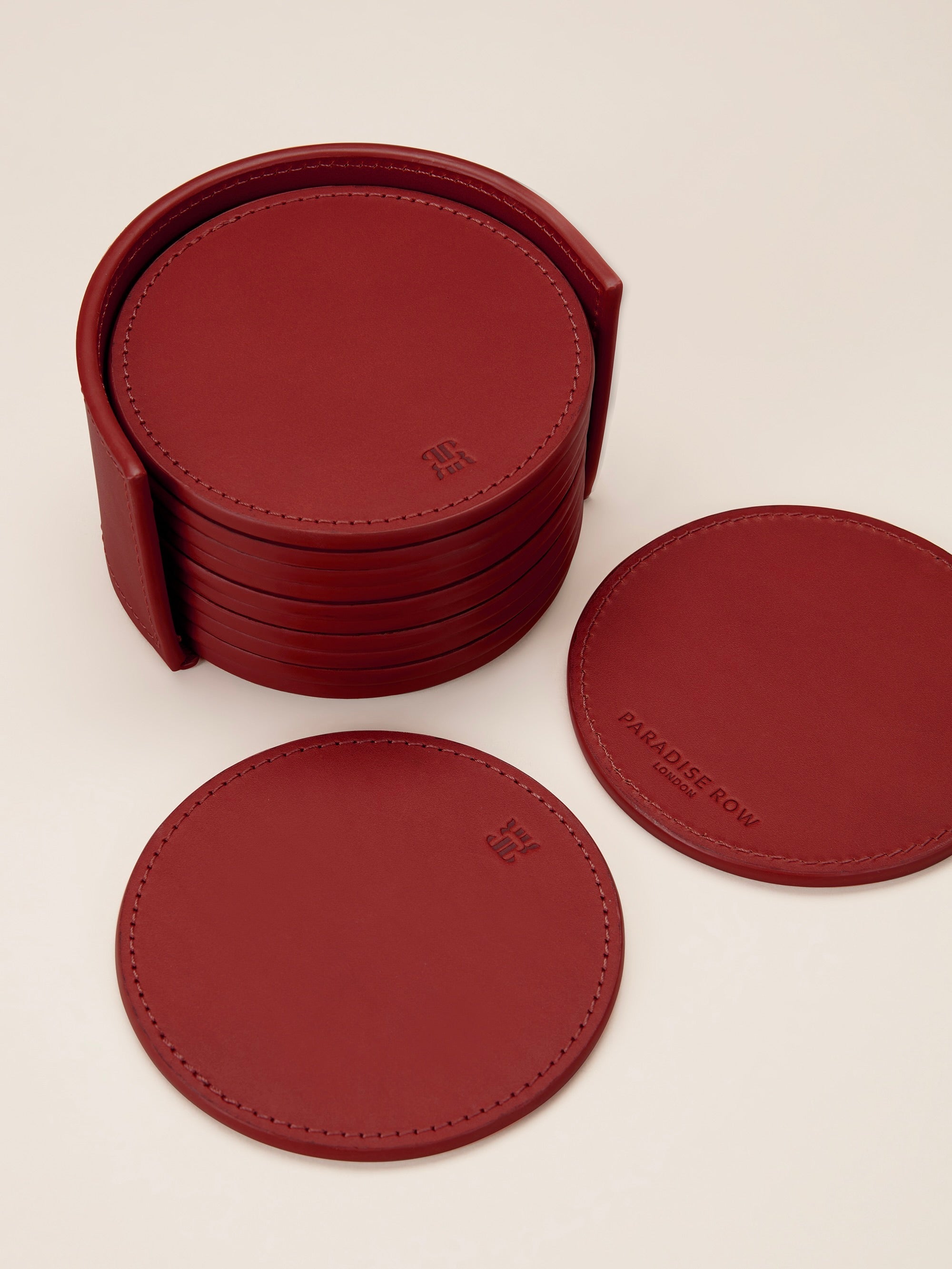 Leather Coasters in Holder (set of 12) — top view of red leather coasters