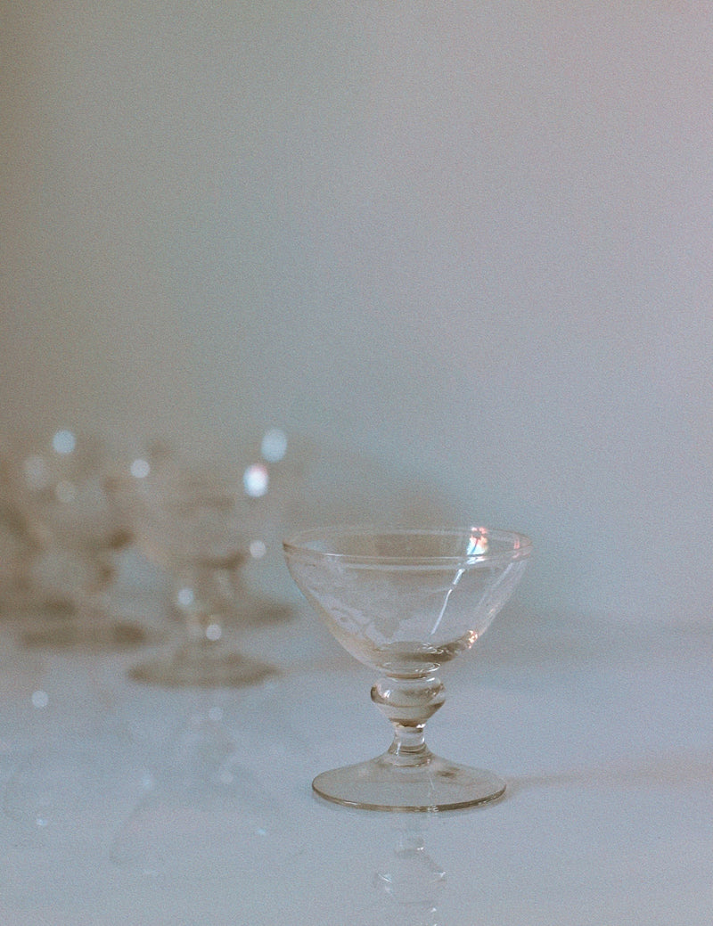 Clear etched floral dessert wine glass with ornate stem design