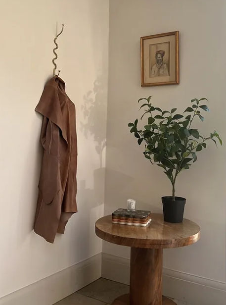 The Meander Hook — close-up of twisted metal hook on wall