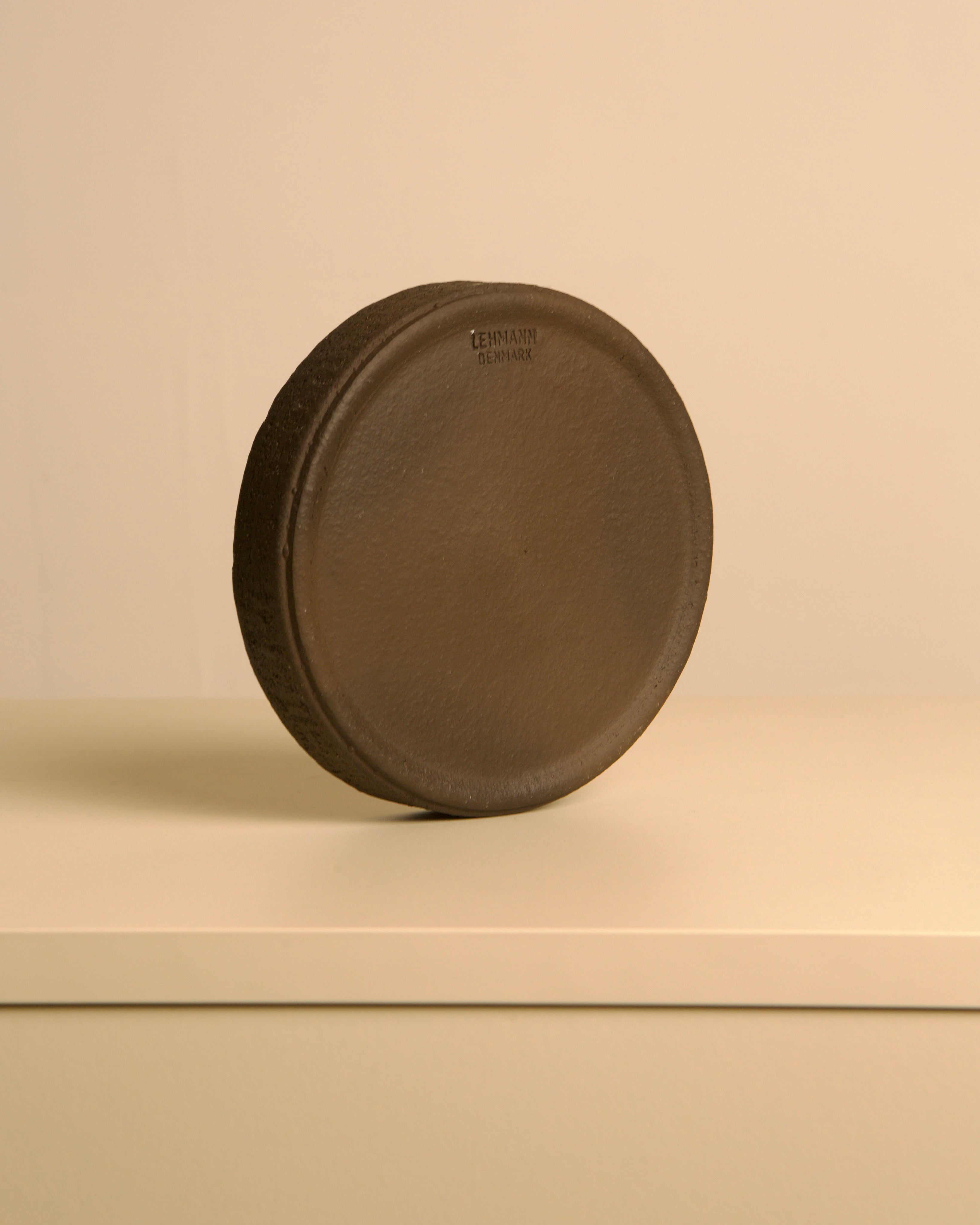 Circular Ceramic Trinket Dish by Jan Van Erp 60's — angled view on neutral surface