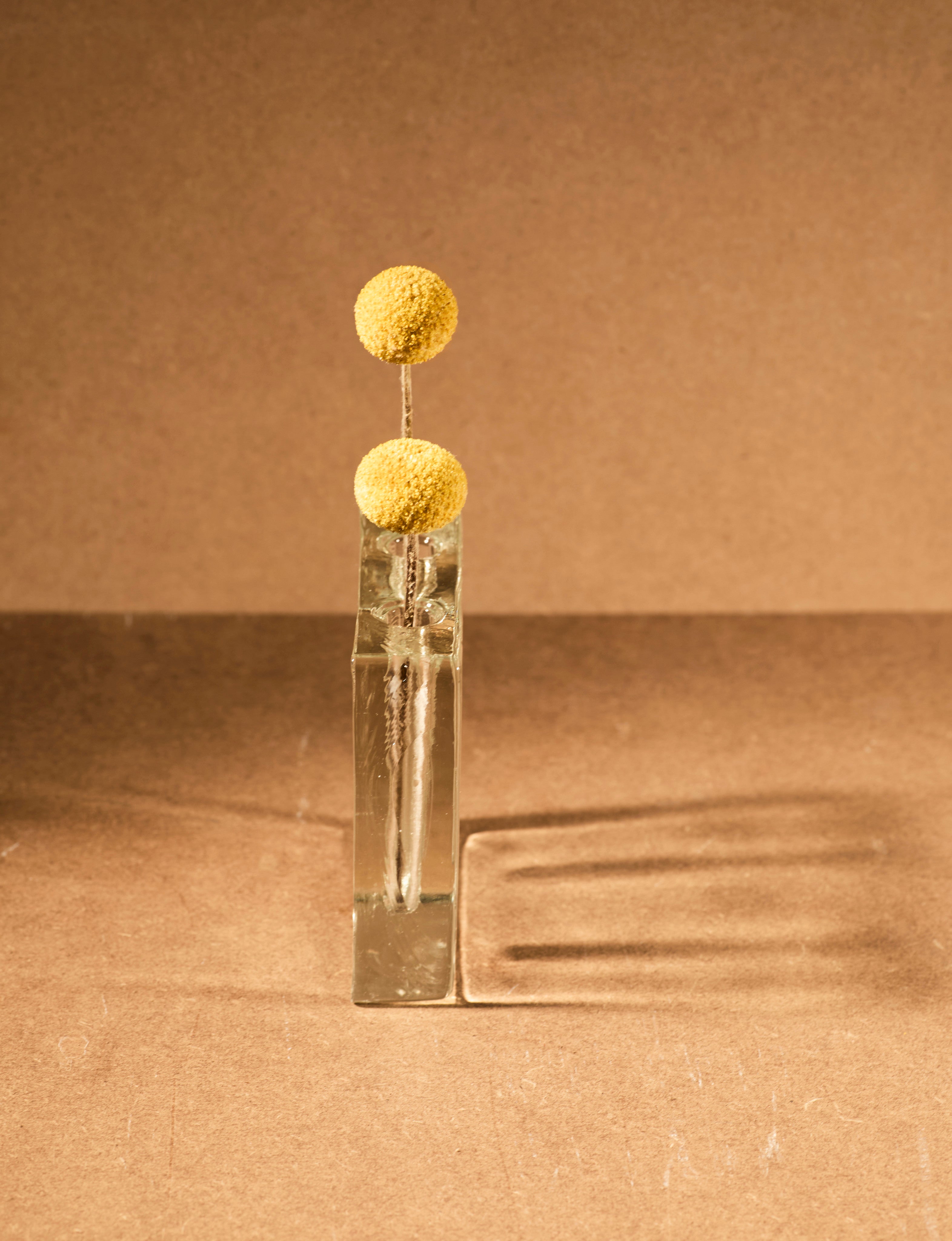 Vintage Scandinavian Clear Vase in Glass c. 1960 — front view with yellow floral arrangement