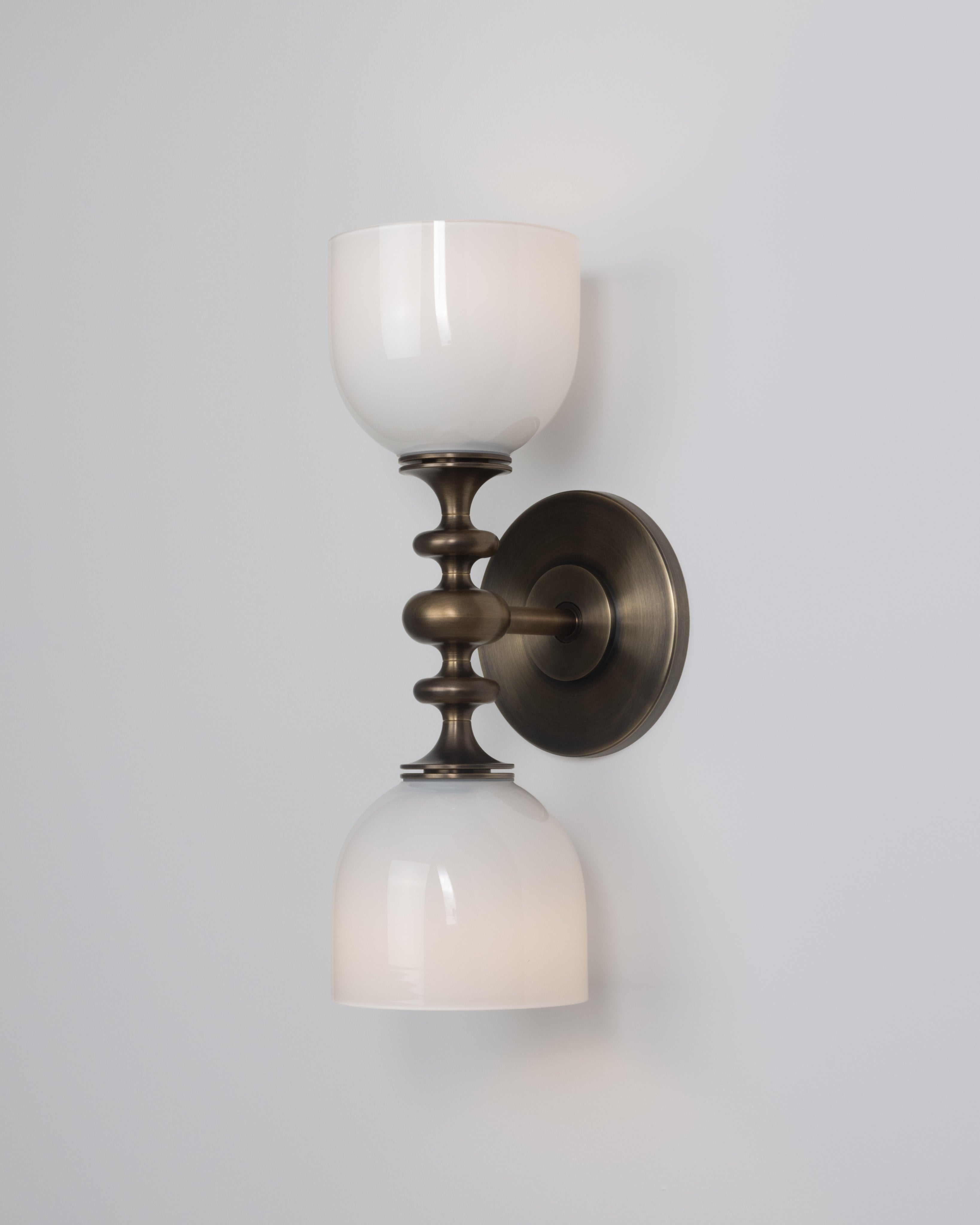 SkLO + AvroKO Marchesa Sconce - White glass, Antique Brass finish — lifestyle setting