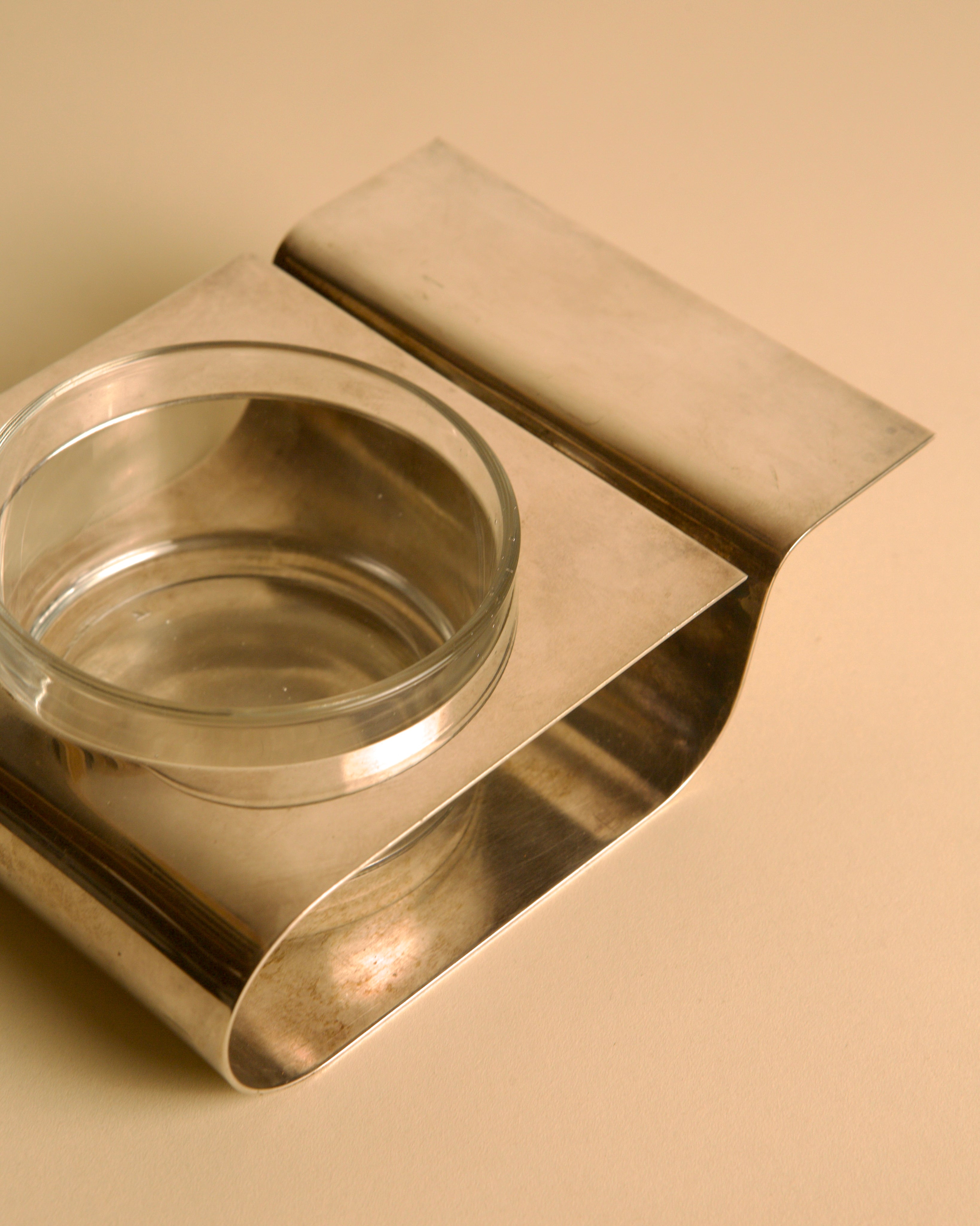 Metal and Glass Tray by Lino Sabattini, 1980s — angled view highlighting metal finish and glass bowl