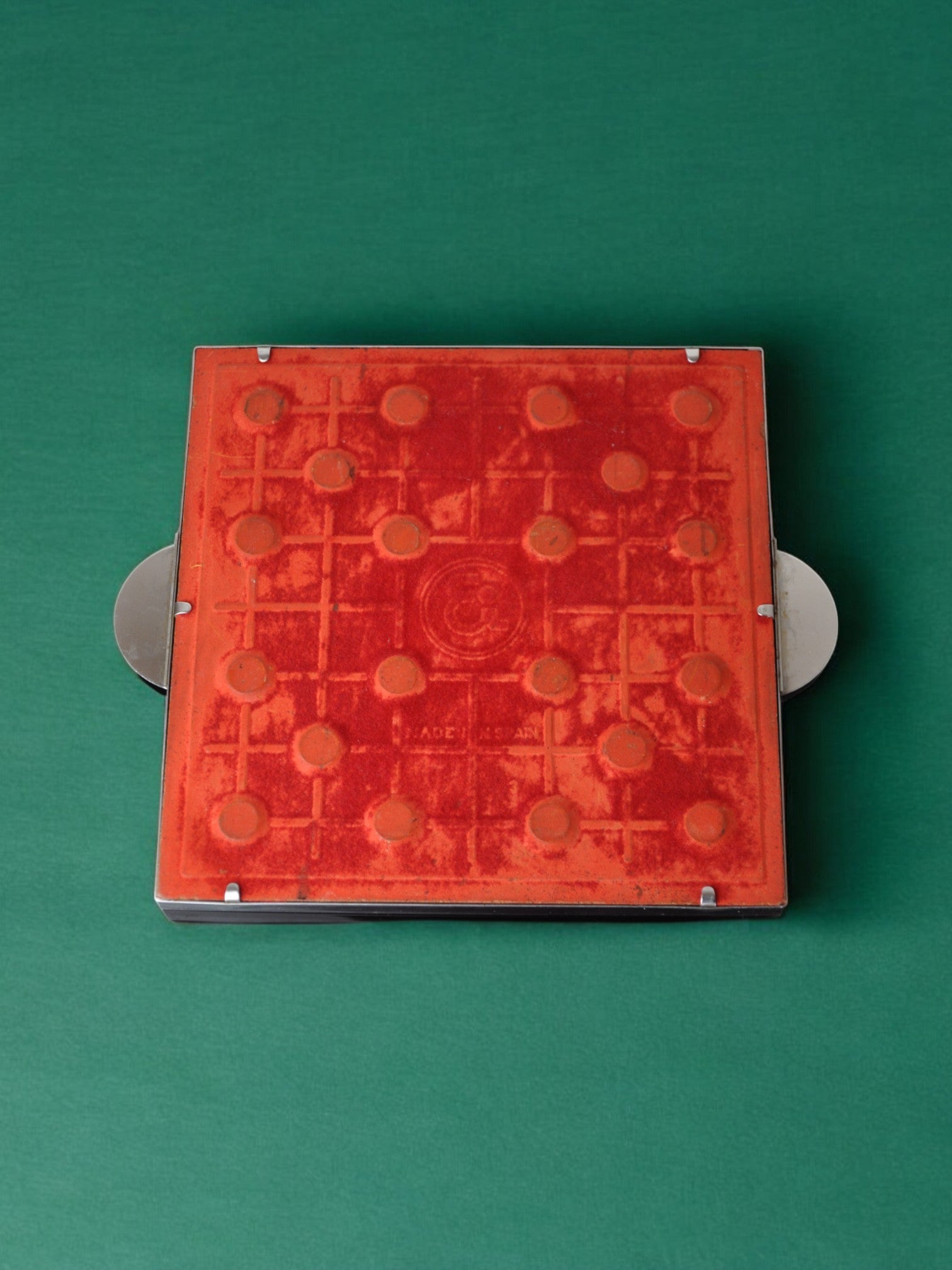 Space Age Spiral Ceramic Trivet, Spain, 1970's — top view on green background