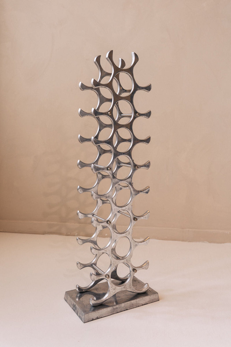 Eichholtz metal wine rack tower with circular bottle holders