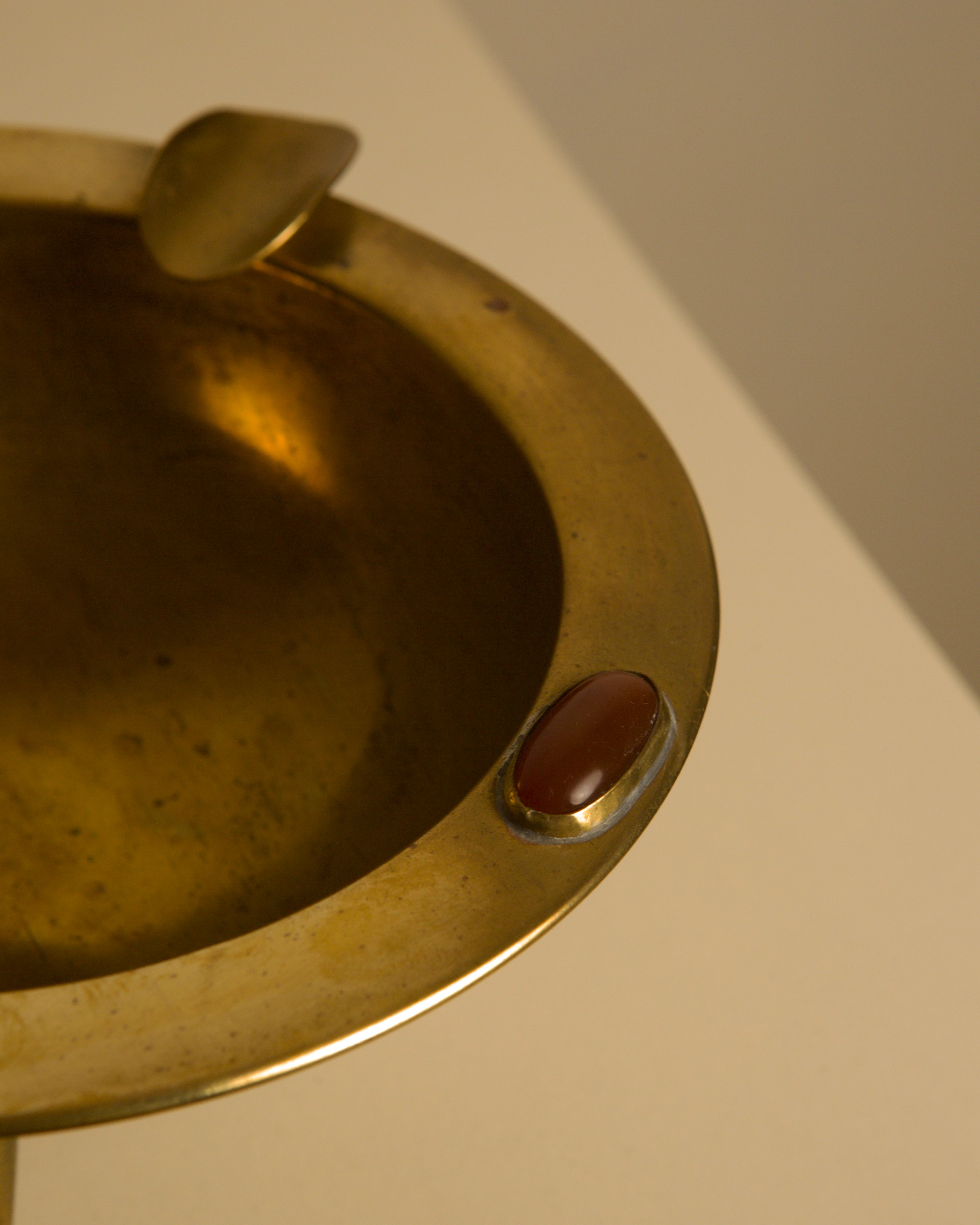 Large Italian Art Deco Brass Ashtray, 1930s — side angle showing brass finish and red stone detail