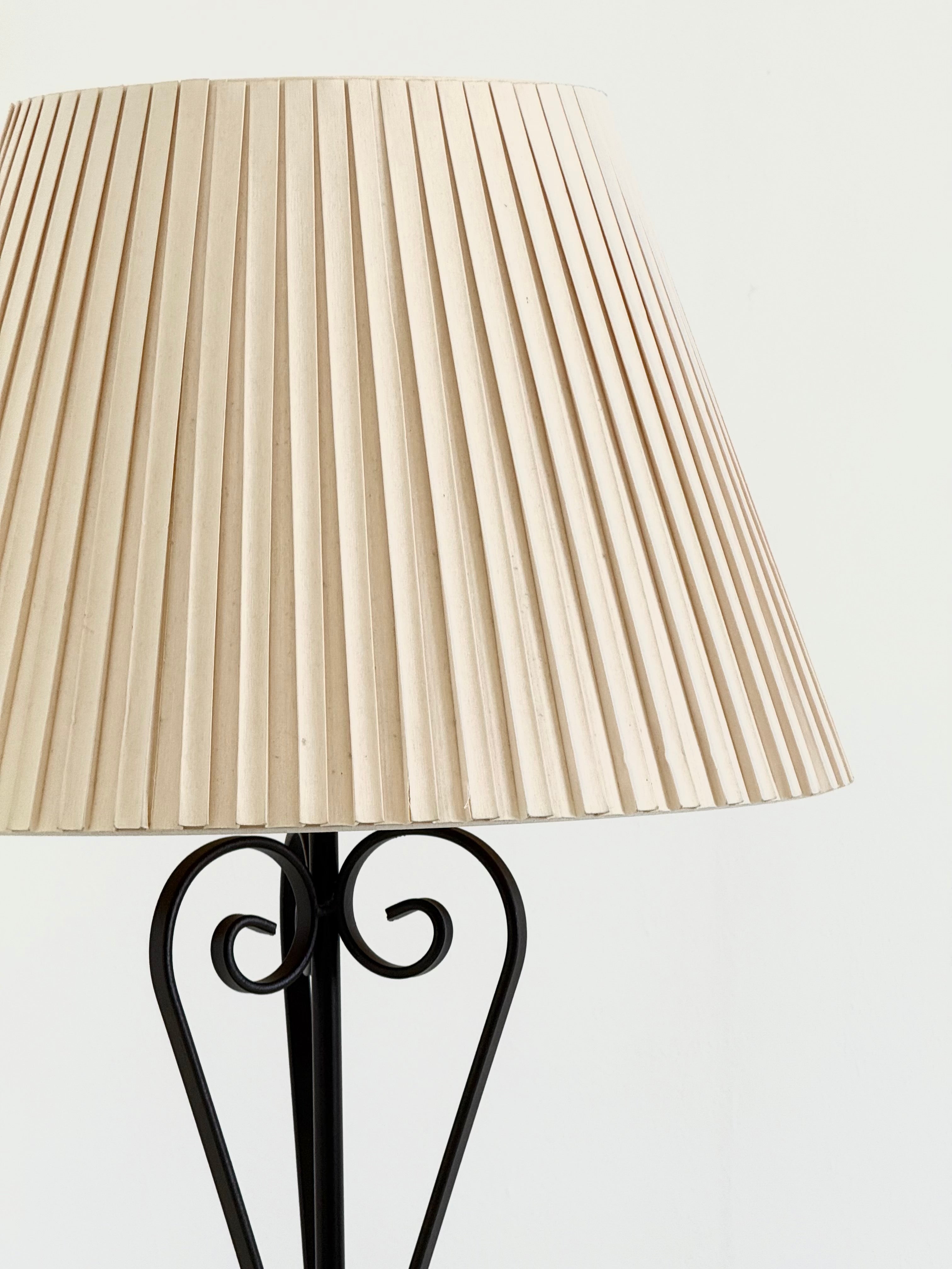 Vintage wrought iron table lamp in a swirl shape with a pleated shade — alternate view