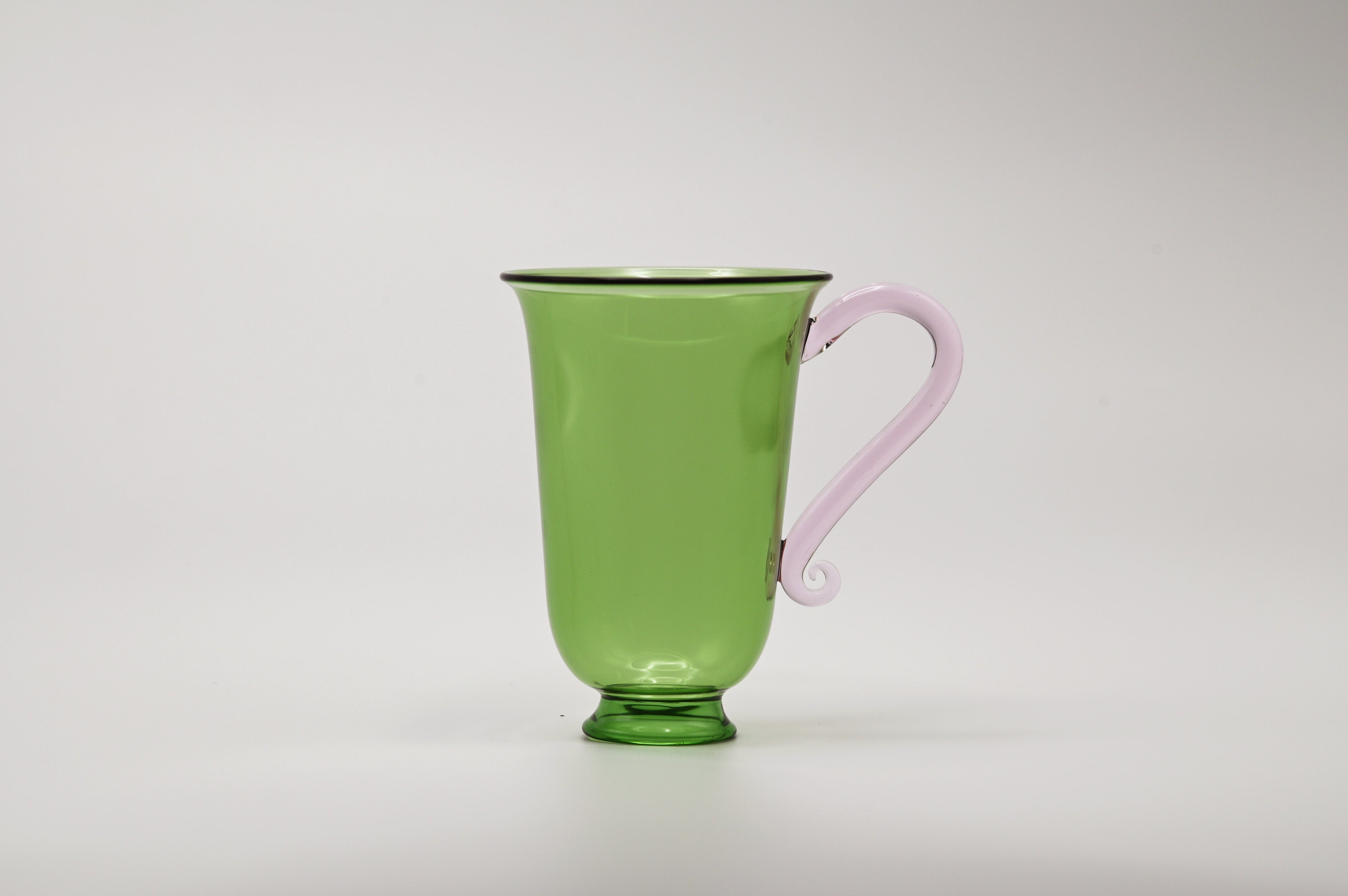 Grande Tasse Set — side view of green glass with pink handle