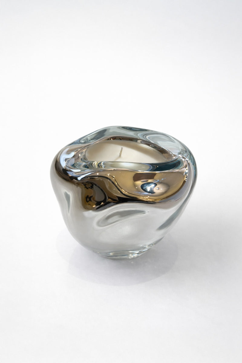 Lumi Candles — close-up of glass candle holder with reflective surface