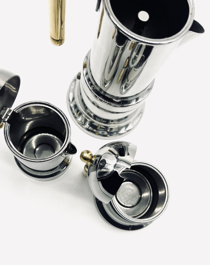 Disassembled vintage Italian stainless steel coffee set components