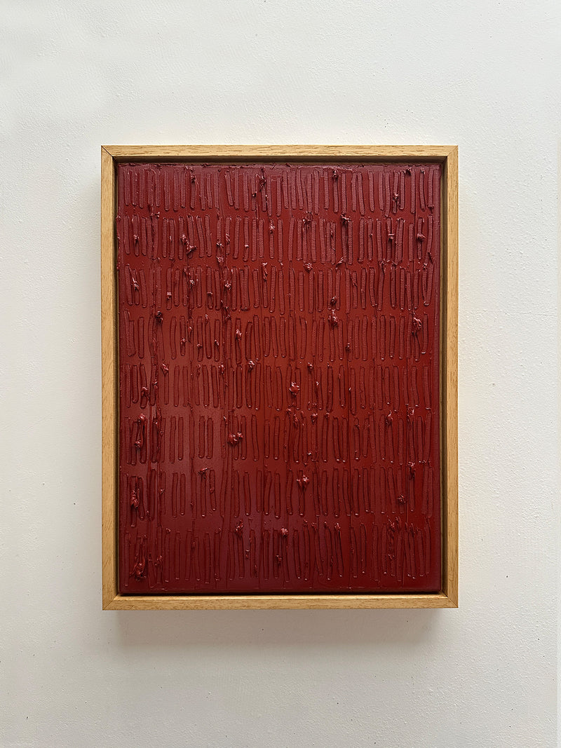 Indian red textured painting with vertical drips in wooden frame