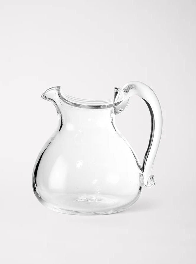 Blixen Jug — close-up of clear glass with curved handle