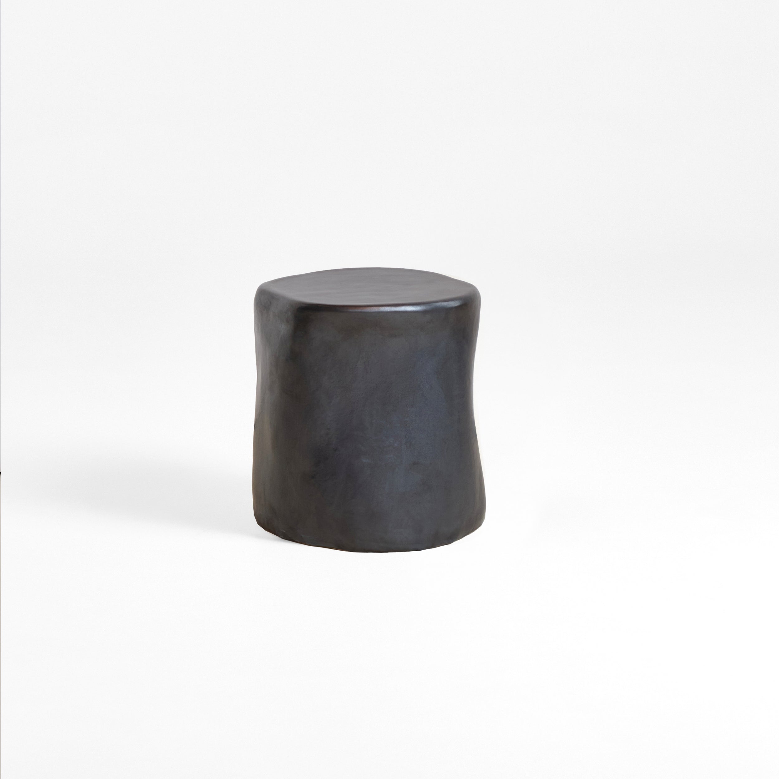 Ceramic Side Table (small) — front view of matte black surface