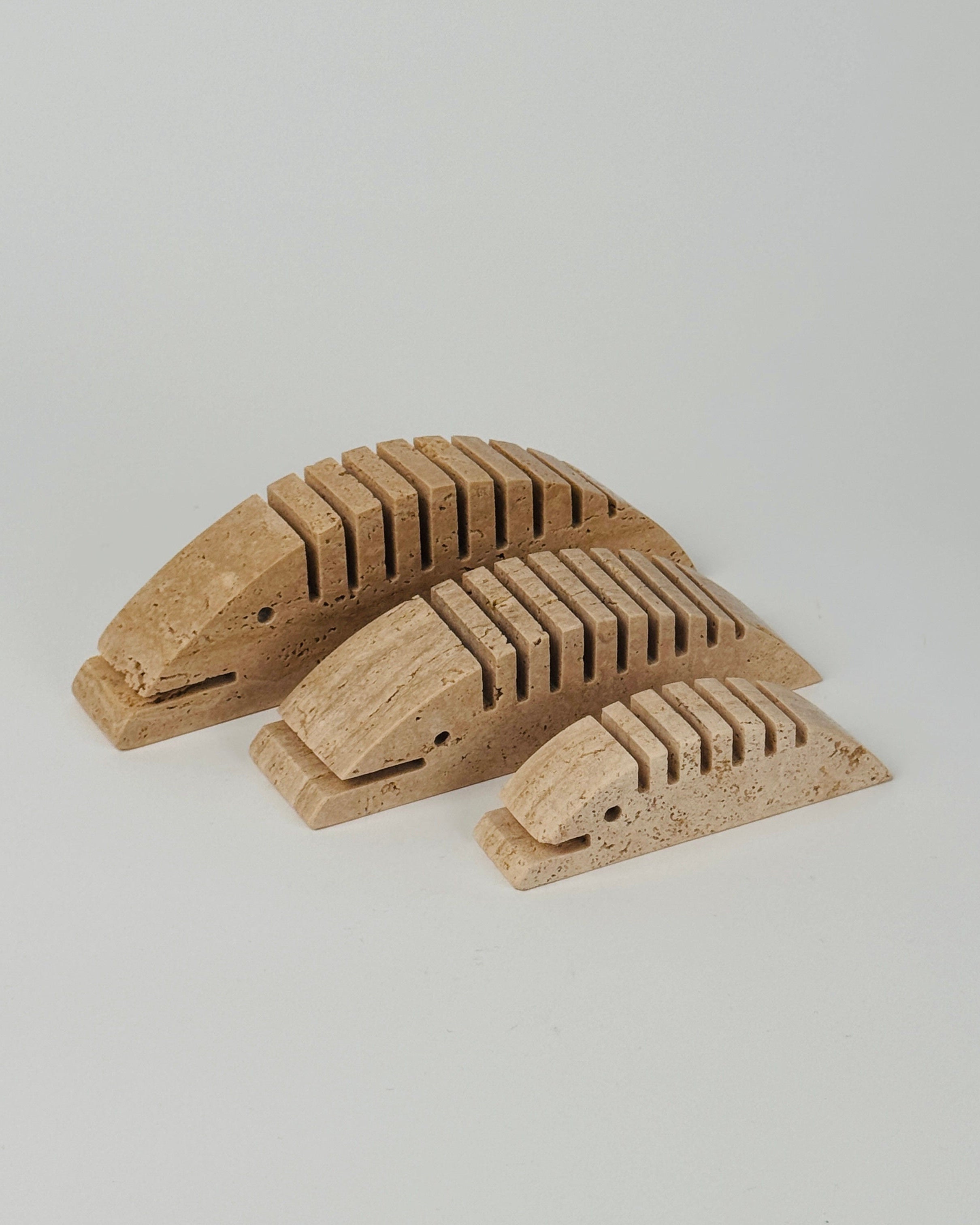 Set of 3 travertine Sculptures by Fratelli Mannelli — arranged on white background