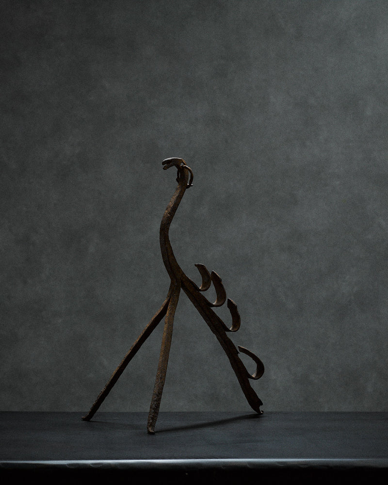 Handcrafted iron sculpture with primal animal motifs by monica monaco | The Oblist — dark rust finish