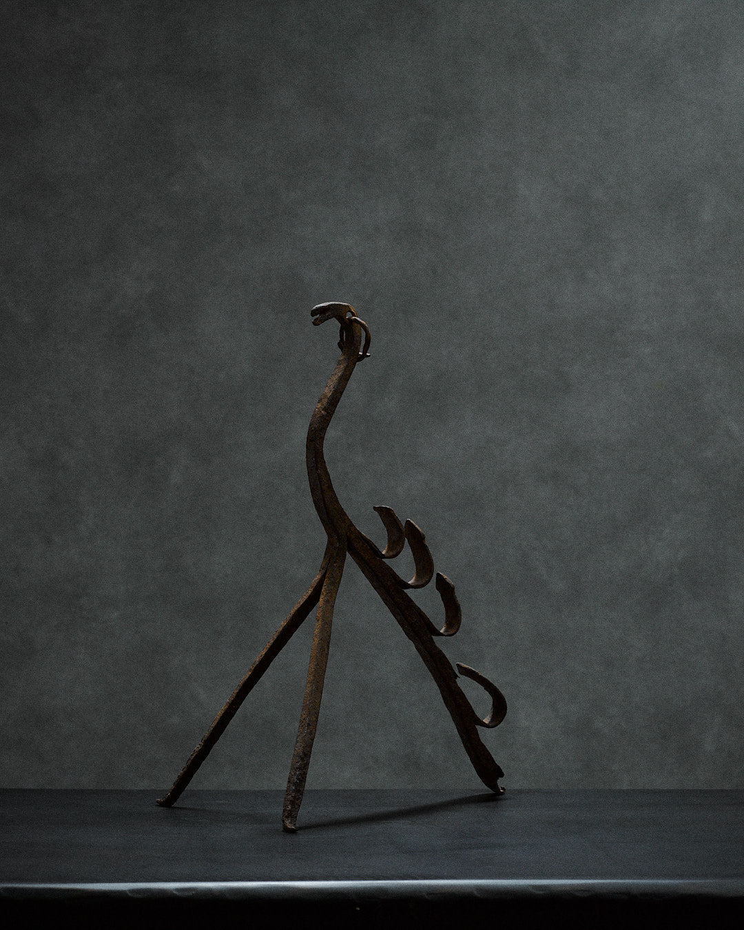 Handcrafted iron sculpture with primal animal motifs by monica monaco | The Oblist — dark rust finish