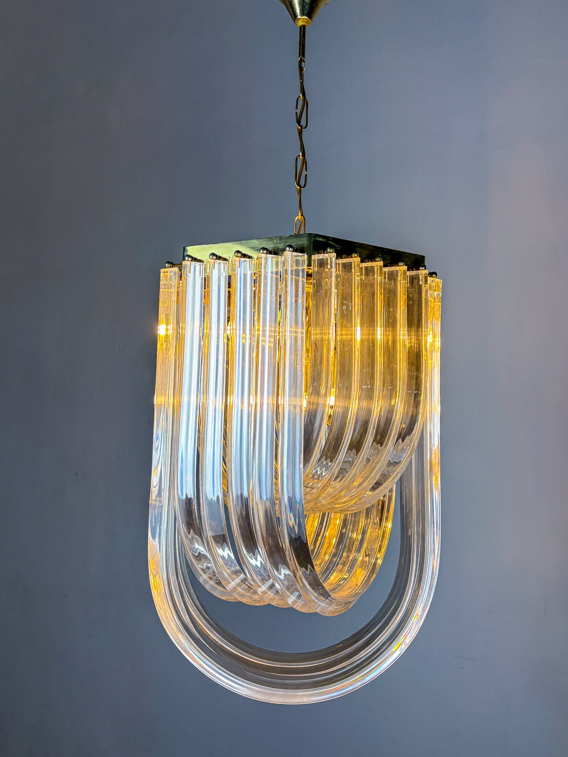 Long Mid-Century Curved Lucite Ribbon Chandelier in Brass, Italy by Malamar Studio | The Oblist