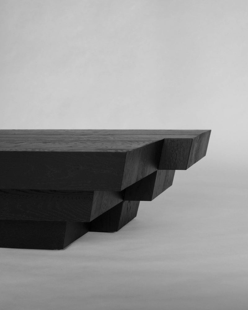 Taes Coffee Table — close-up of black wood edge detail
