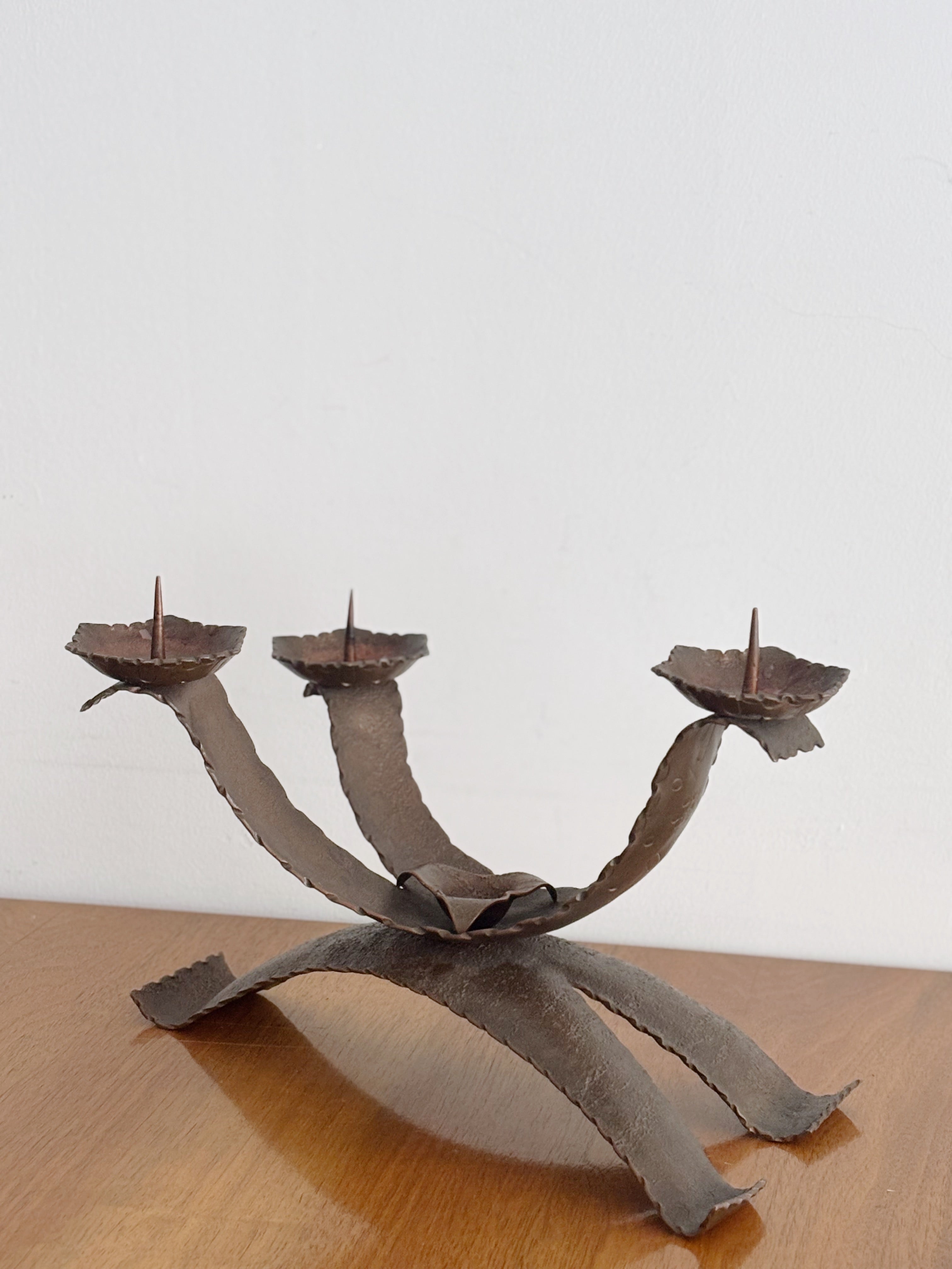 Large Metal Curved Artisan Candlestick, Poland — close-up of textured metal design