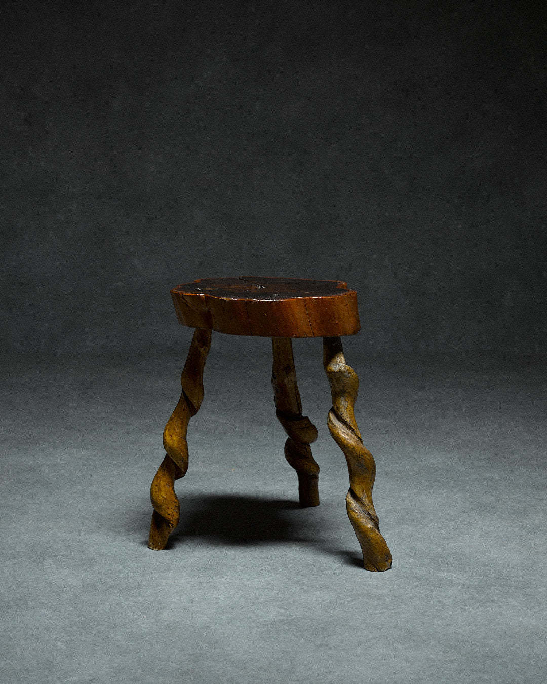 Small Tripod Stool — angled view of twisted wooden legs