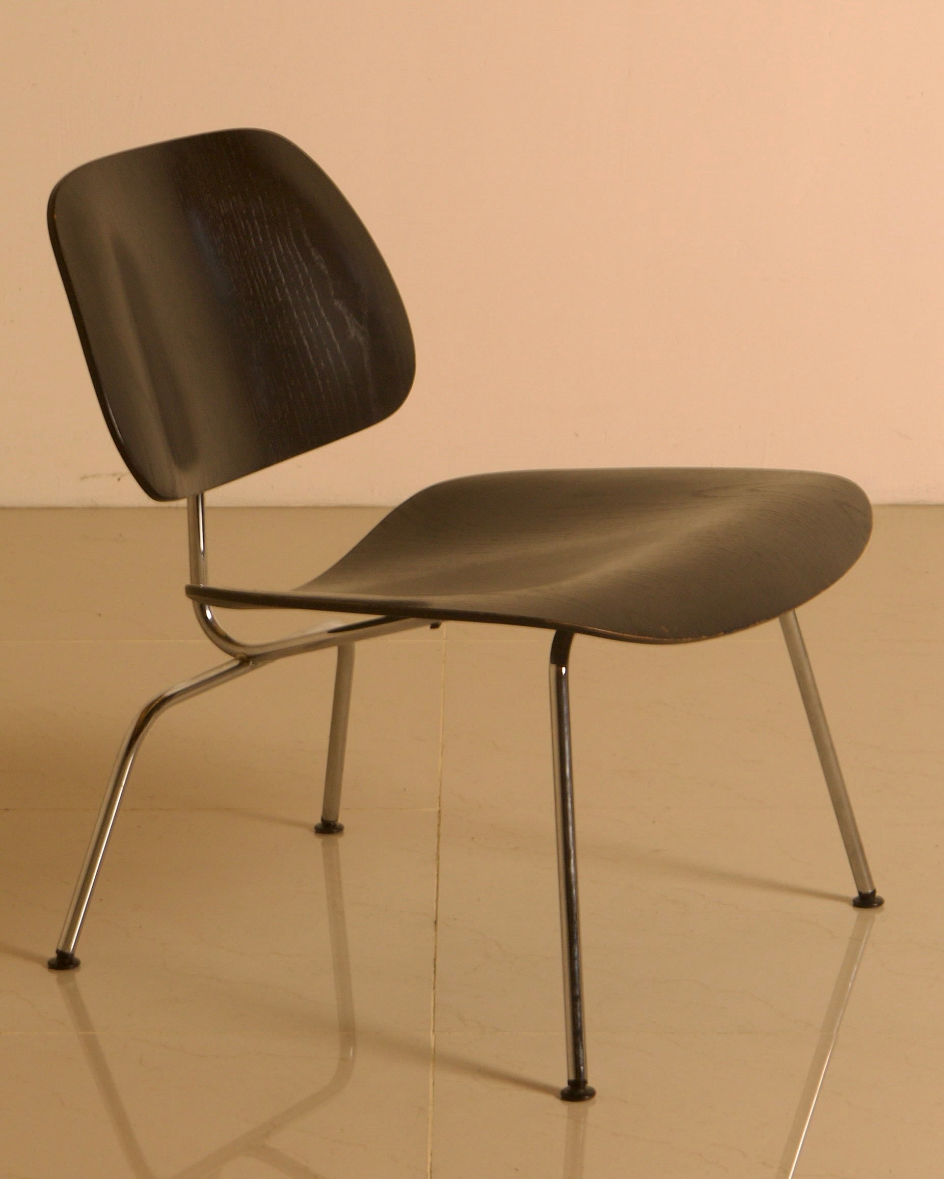 LCM Chairs by Charles and Ray Eames for Herman Miller, 1960s — side angle showing black wood seat and chrome legs