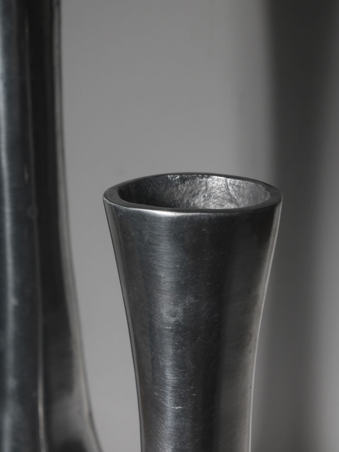 Polished Aluminum Circular Cutout Tall Vases Set — lifestyle setting