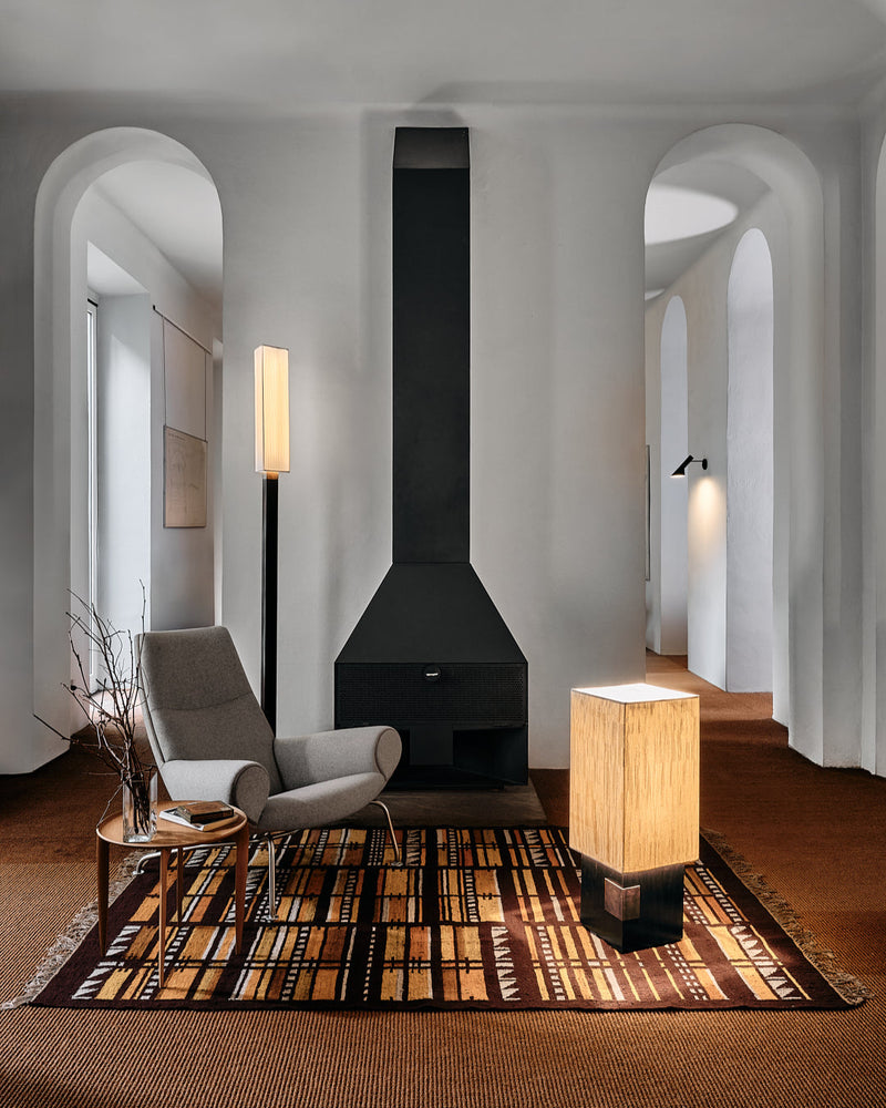Aldebaran floor lamp in modern living room with fireplace
