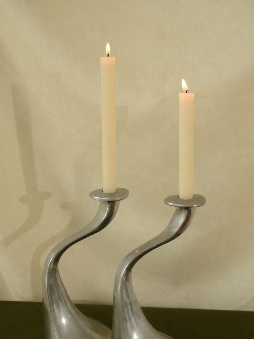 A Sculptural Set of 2 Inox Candle Holders — detail view