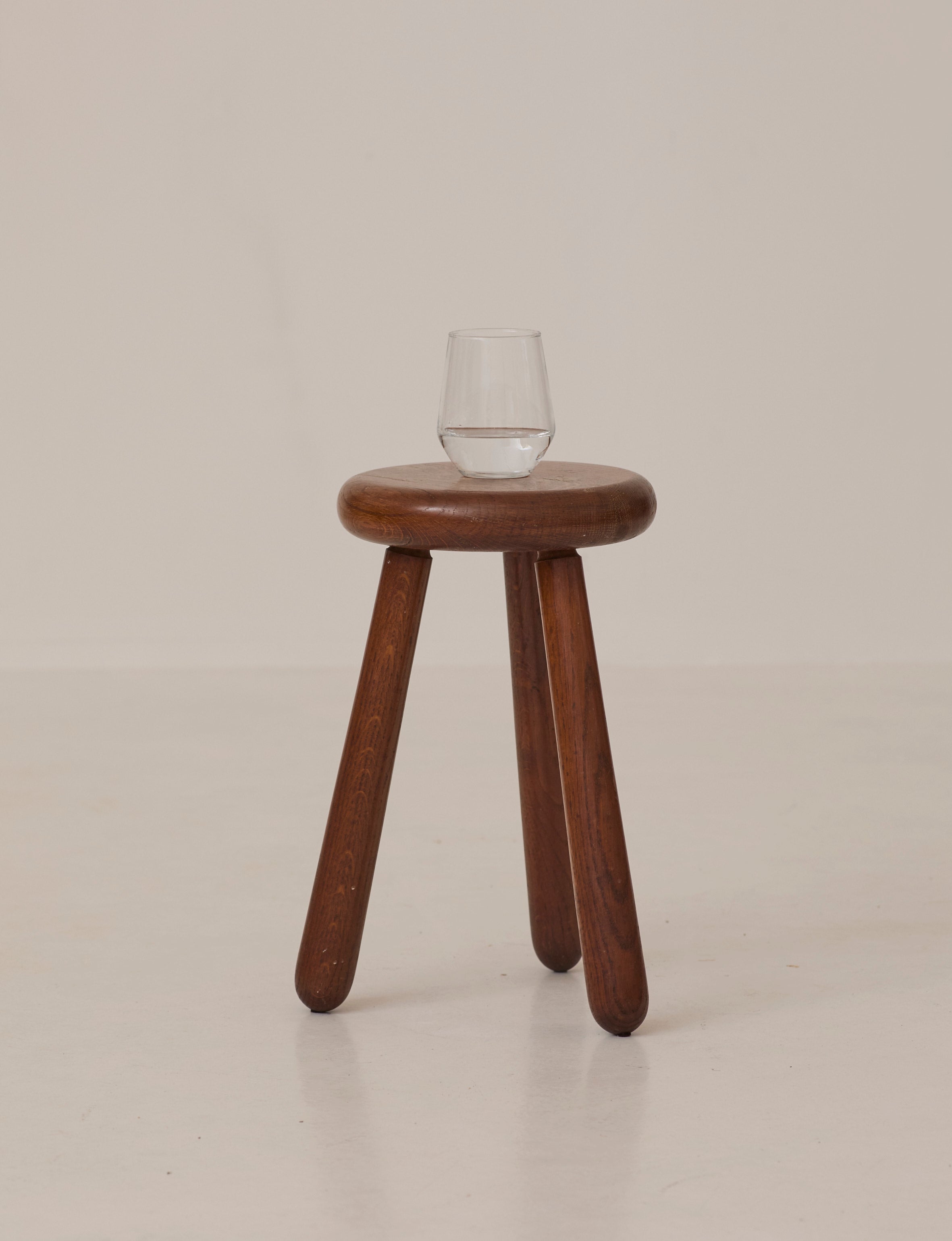 Brutalist Tripod Stool Handcrafted in Solid Oak Wood C. 1960 — front view with glass on top