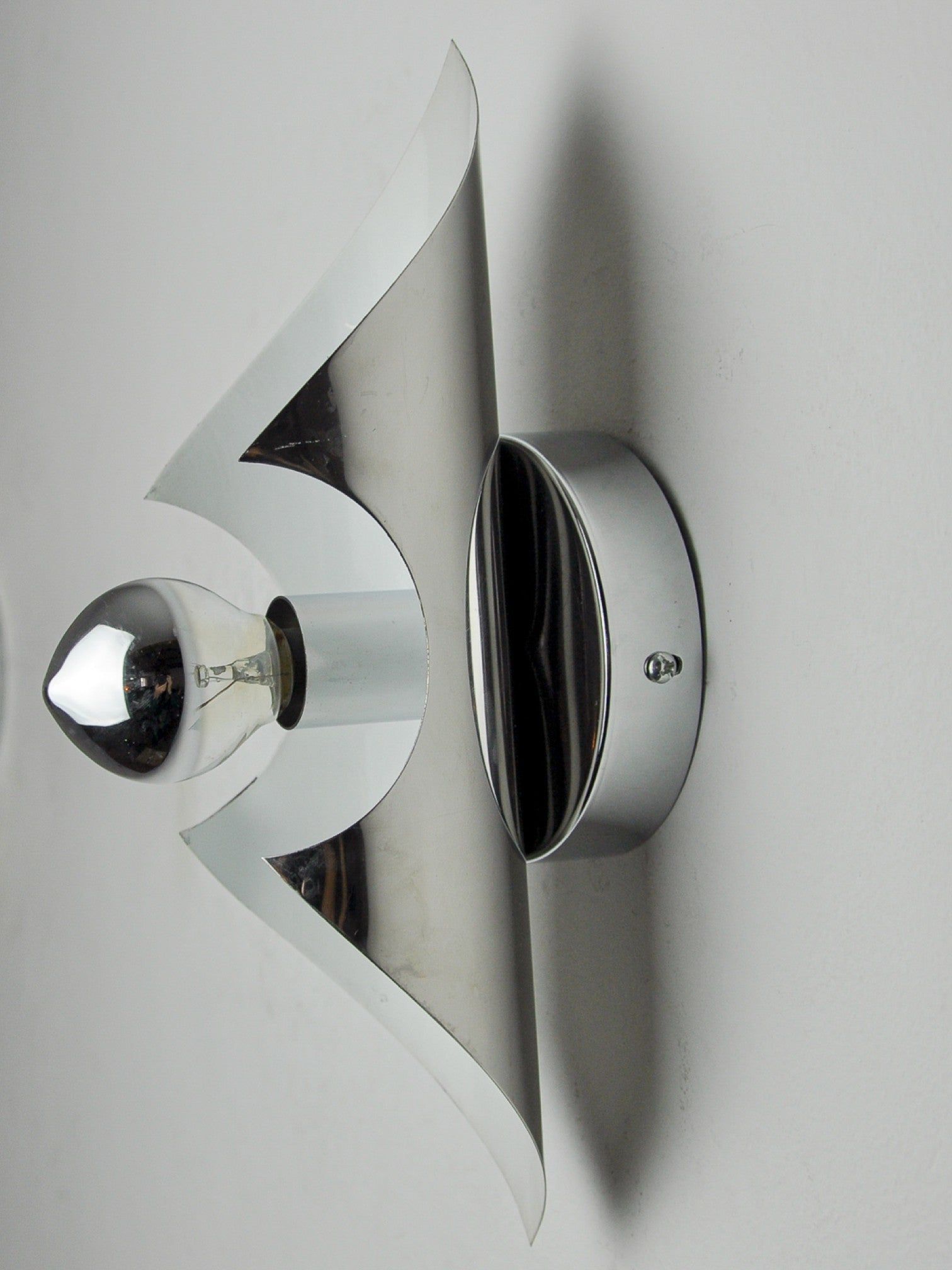 Pair of "Folio" Wall Lights, Italy, 1970s — top view showing chrome finish and bulb