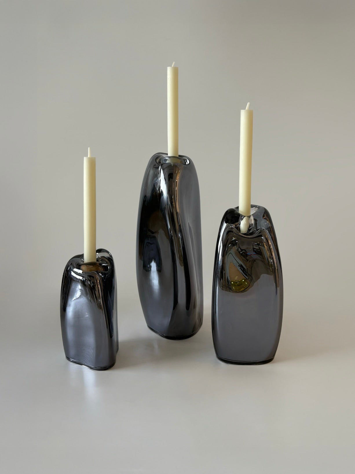 Lumos Candle Holders — top view of glossy black ceramic design