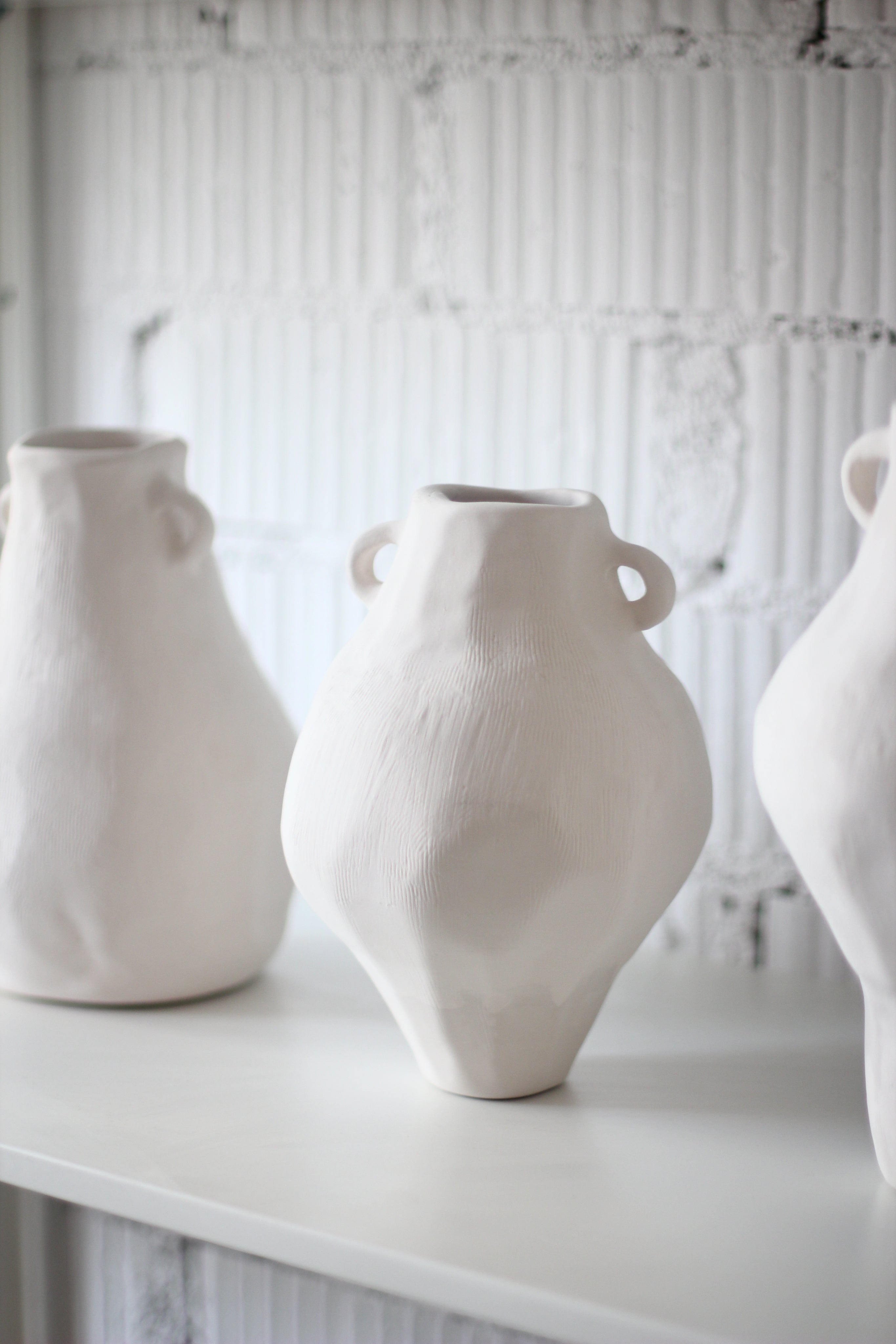 Ceramic Vase Cos 03 — side angle showing textured white ceramic surface