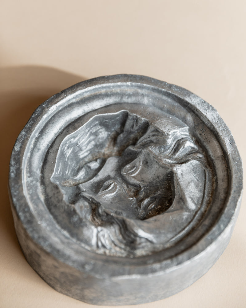 Metal ashtray with sculpted face relief detail, Italy 1950s