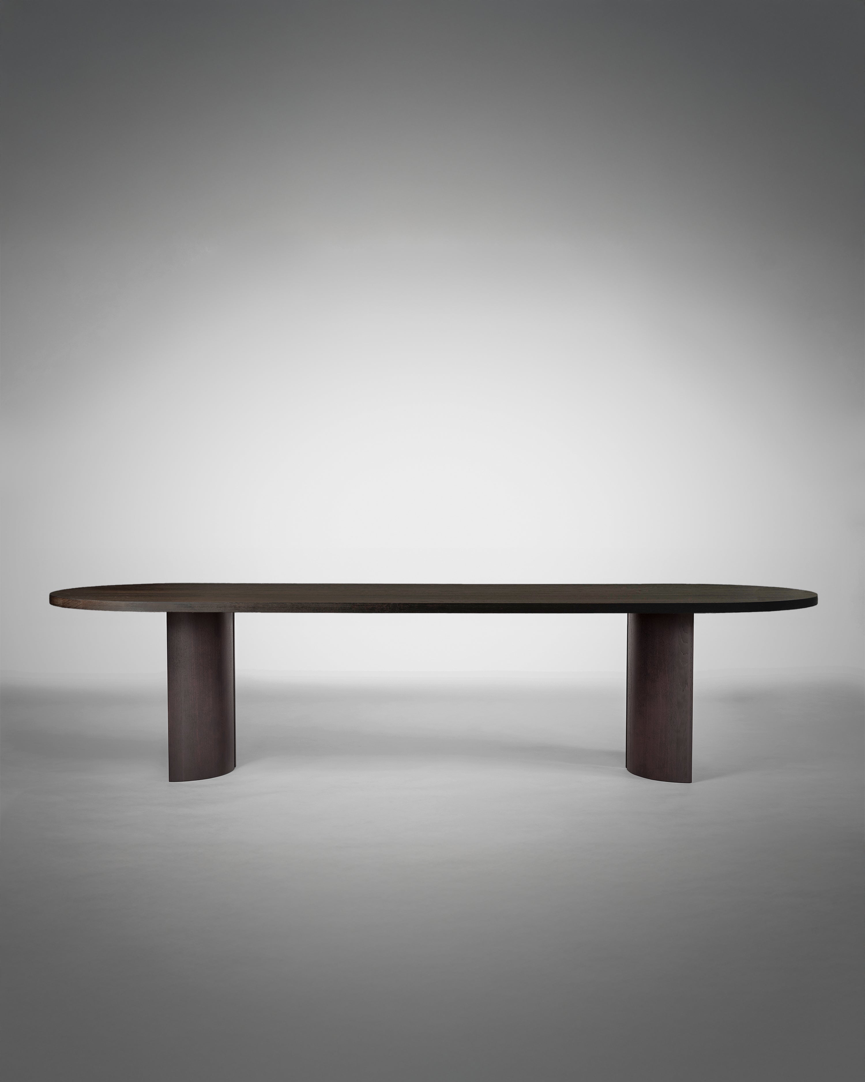 Aperta Capsule Table - Single Base — front view with dark wood finish
