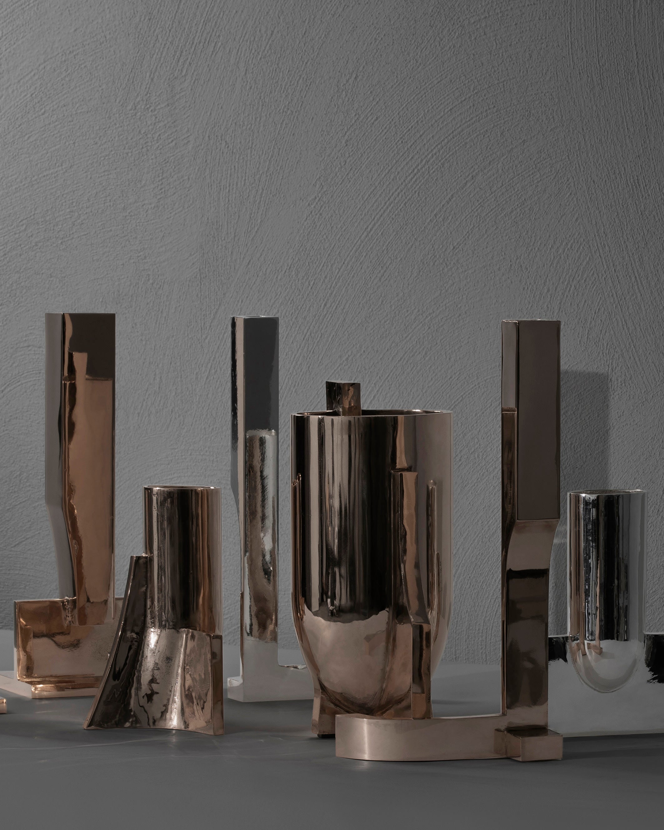 Case obj.8 - Candleholder Wall Piece — side angle of polished metal design