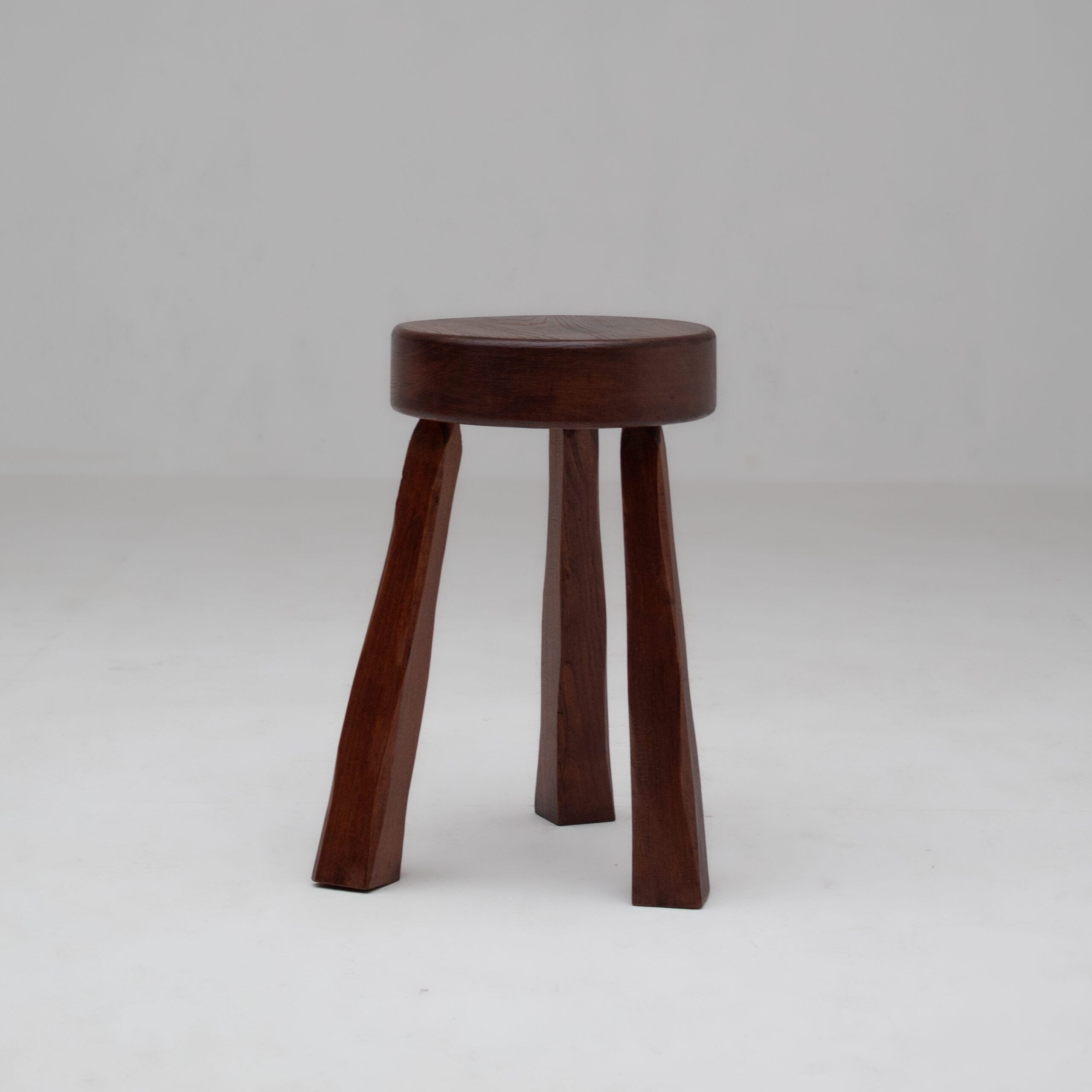 Round Wooden Stool — side angle showing dark wood legs