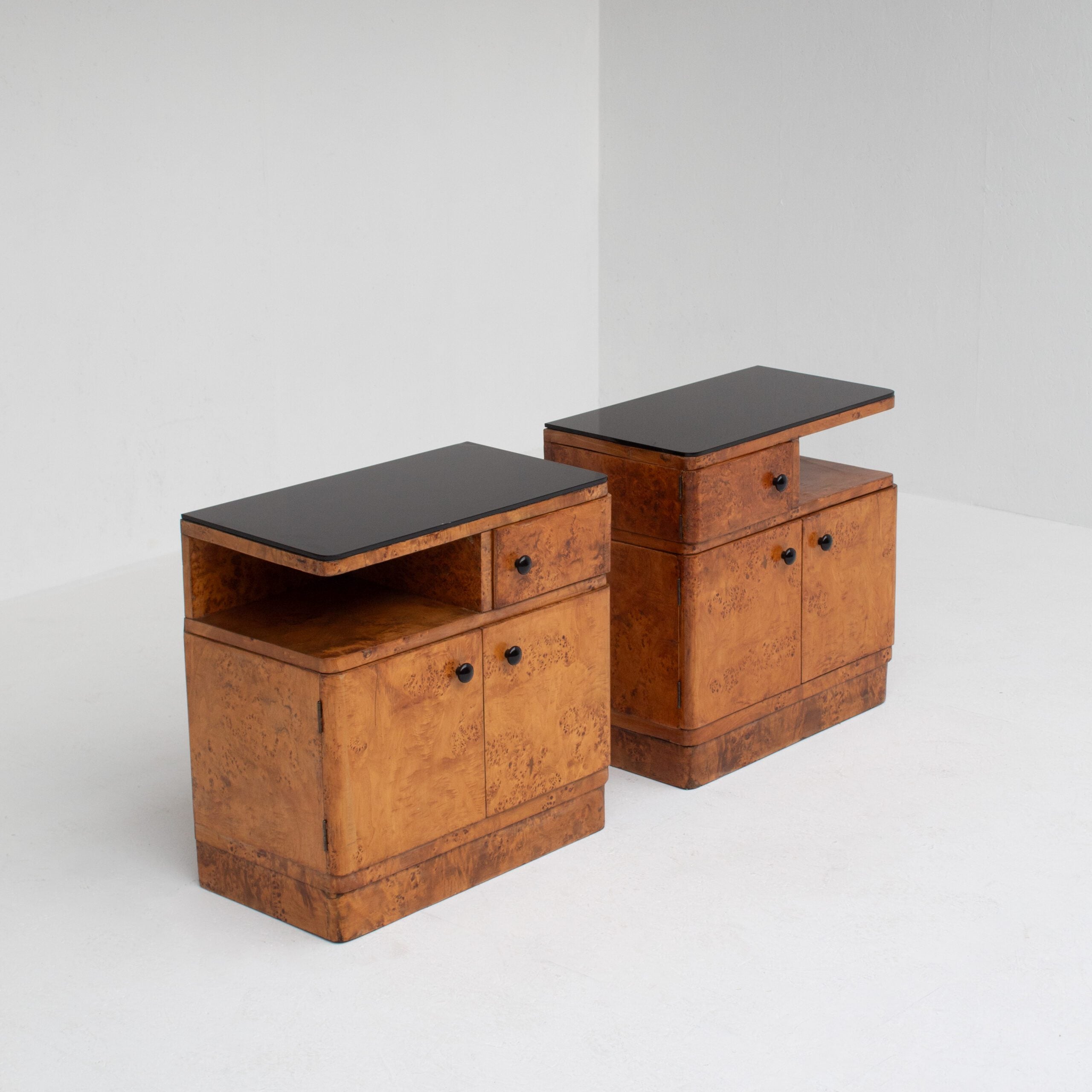 Pair of Art Deco Nightstands in Burlwood — side angle showing black top and drawers