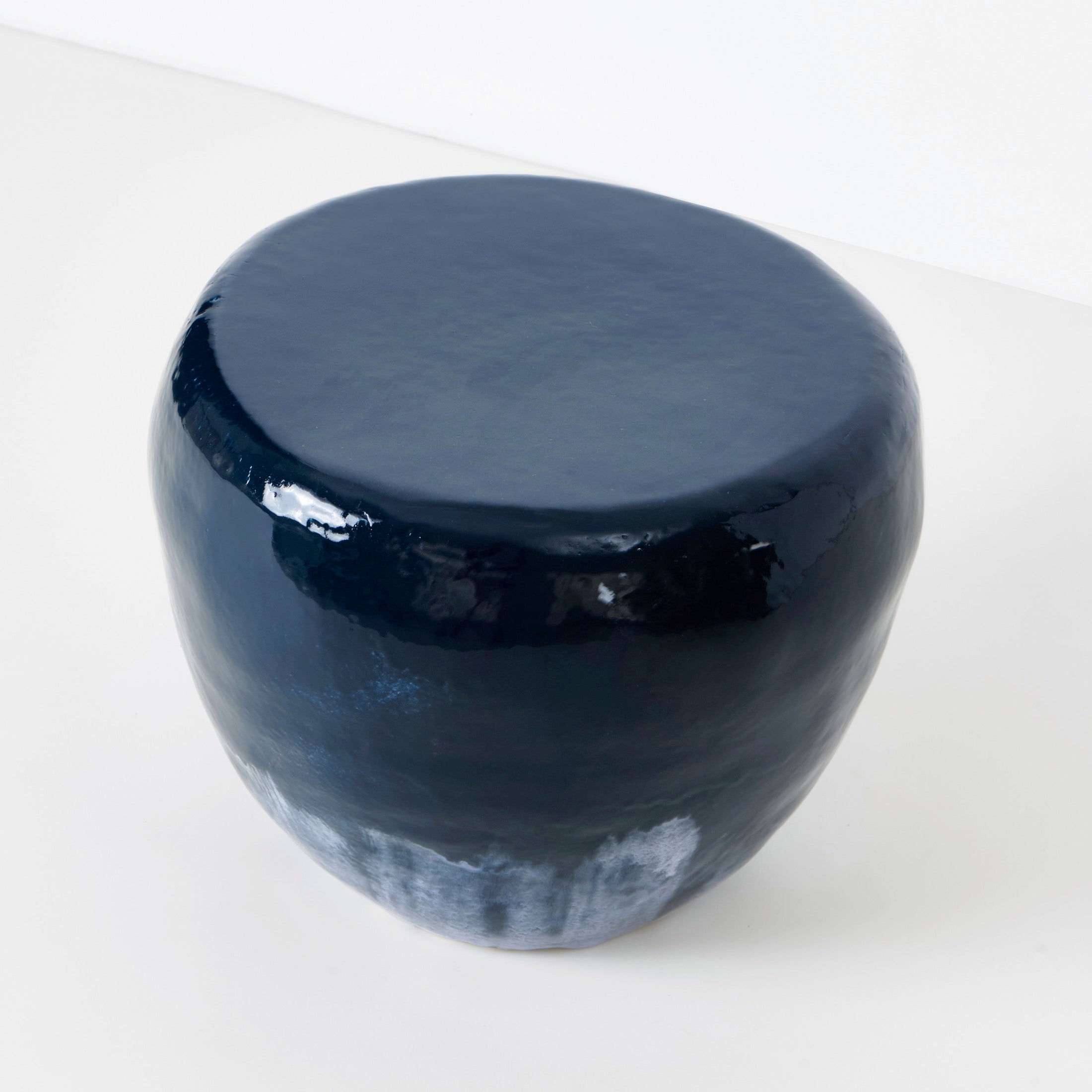Medium Ceramic Side Table — top view of glossy navy surface