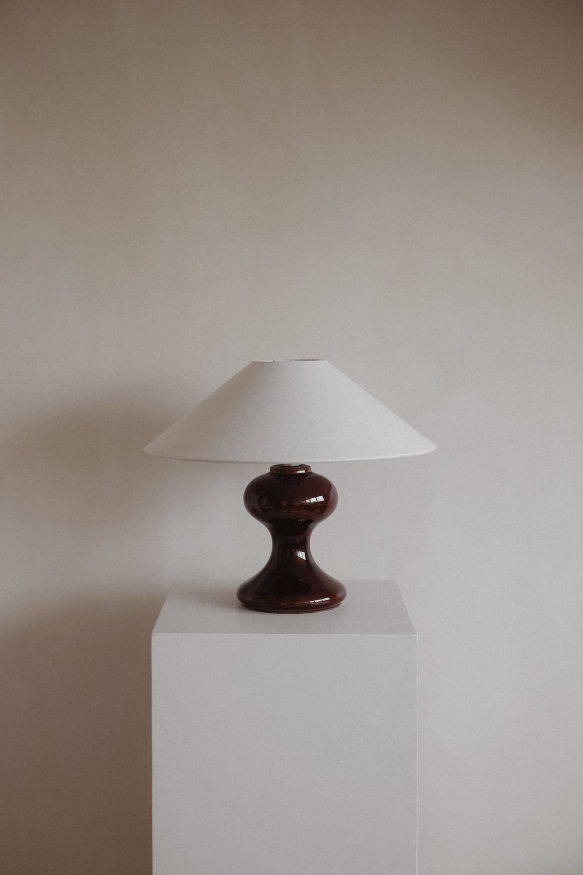 The Cordovan Hourglass Ceramic Table Lamp — close-up