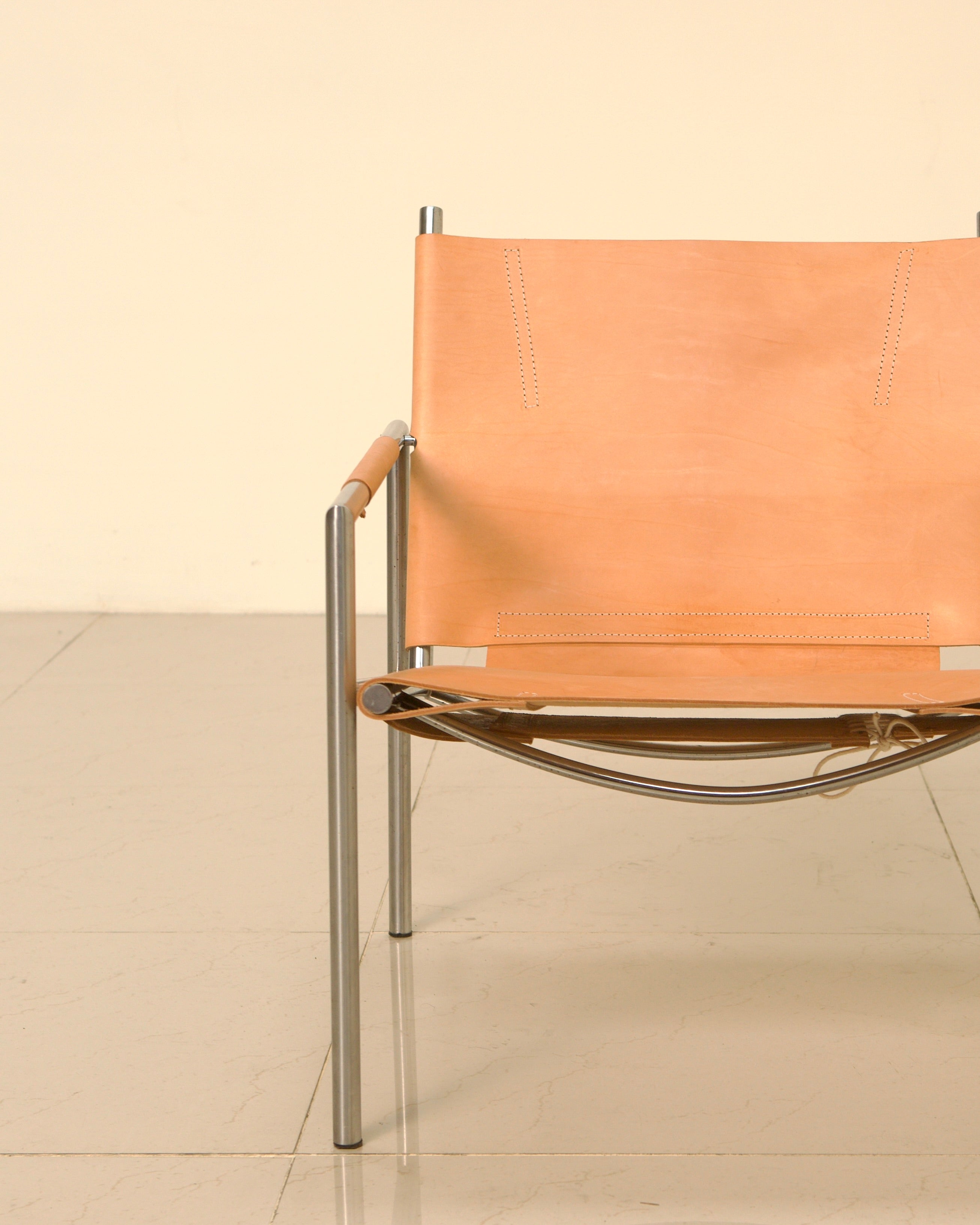 Modern orange leather SZ02 armchair with chrome frame detail