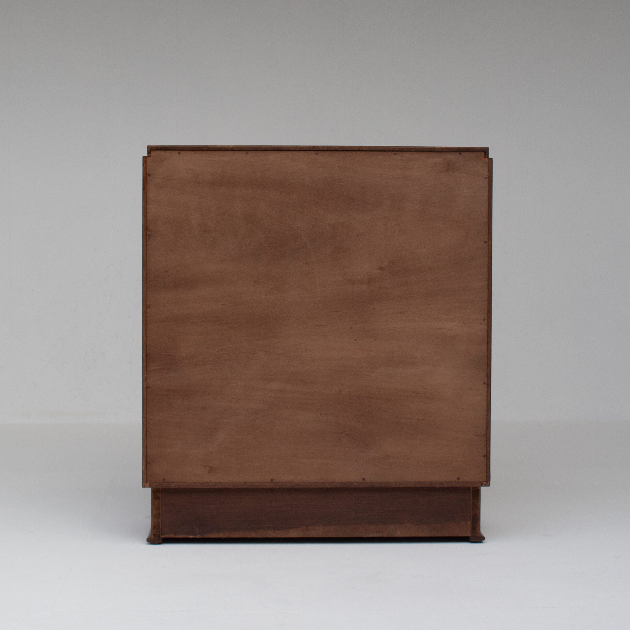 Mid-Century Oak Cabinet with Brass Handles and Decorative Inlays — lifestyle setting