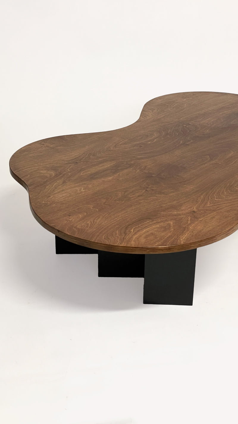 Spill Table - Oak Black by Goons — angled view of oak tabletop with black legs