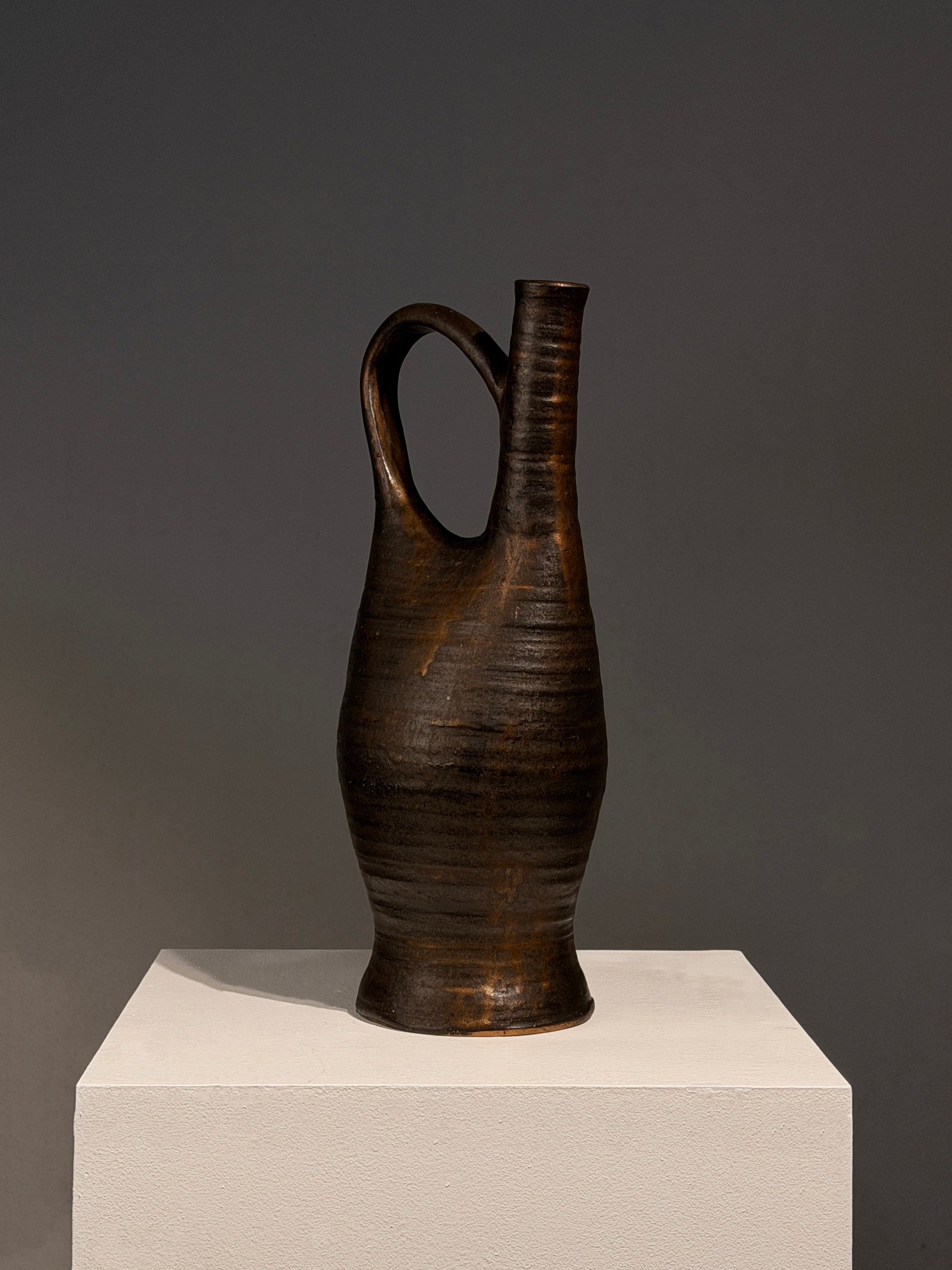 Large Stoneware Pitcher by Bernadette Sulmont, France, circa 1960 — side angle showing textured dark surface on pedestal