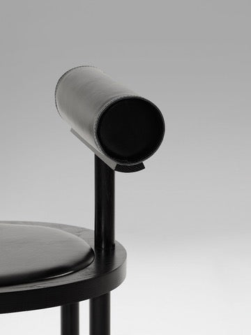 UNA Chair by Estudio Persona — close-up of black leather armrest