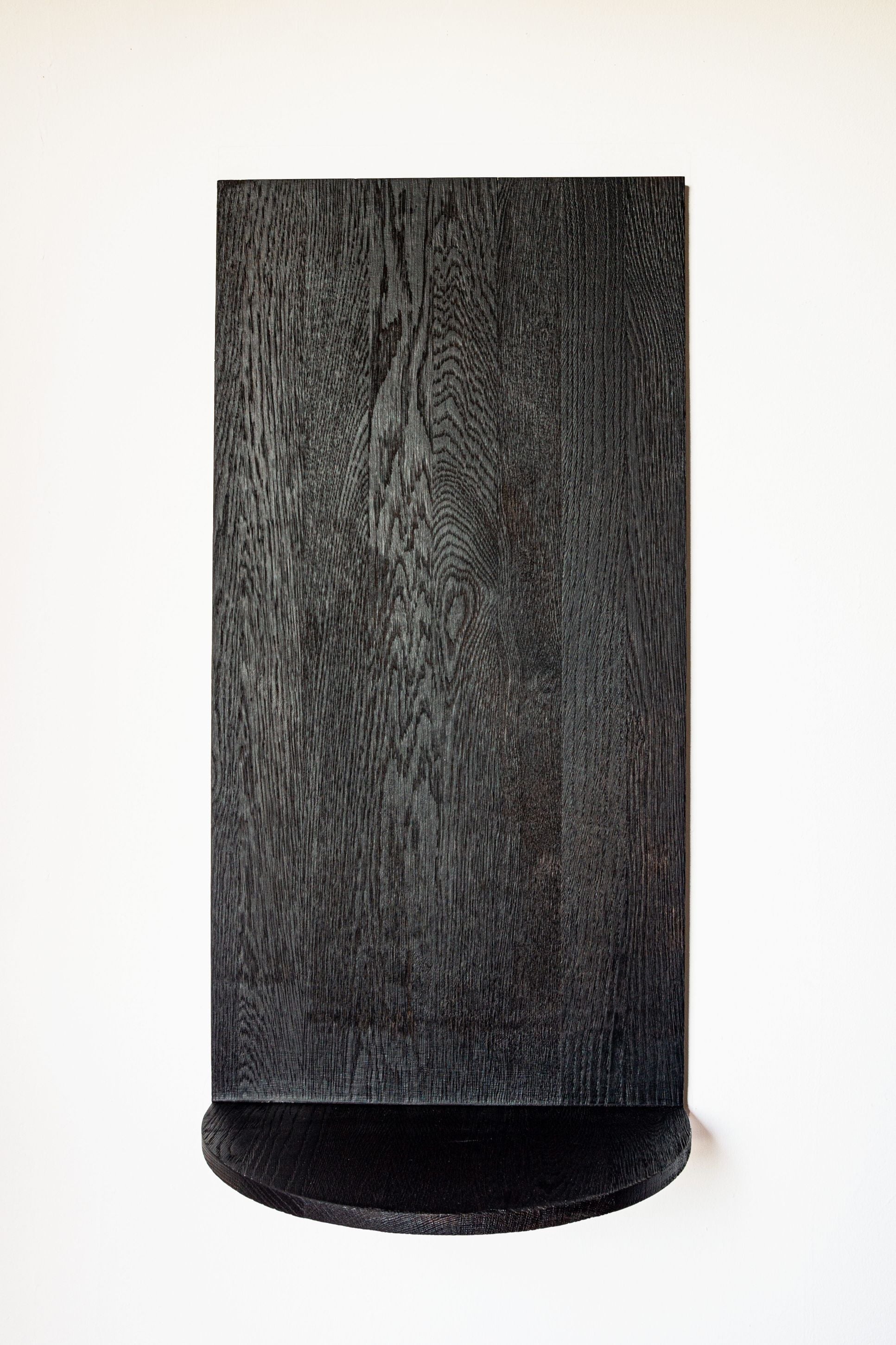 Megaron black oak shelf showing curved base detail