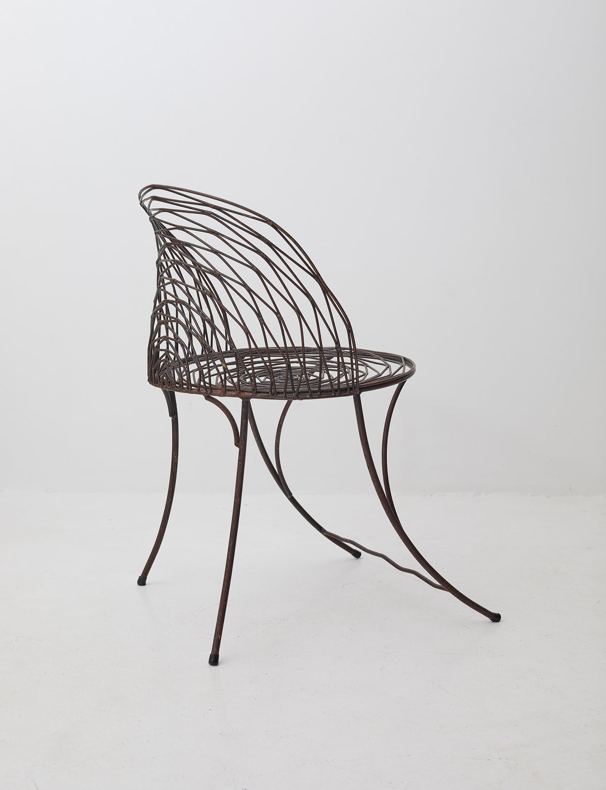 French 20th Century wrought iron armchair — lifestyle setting