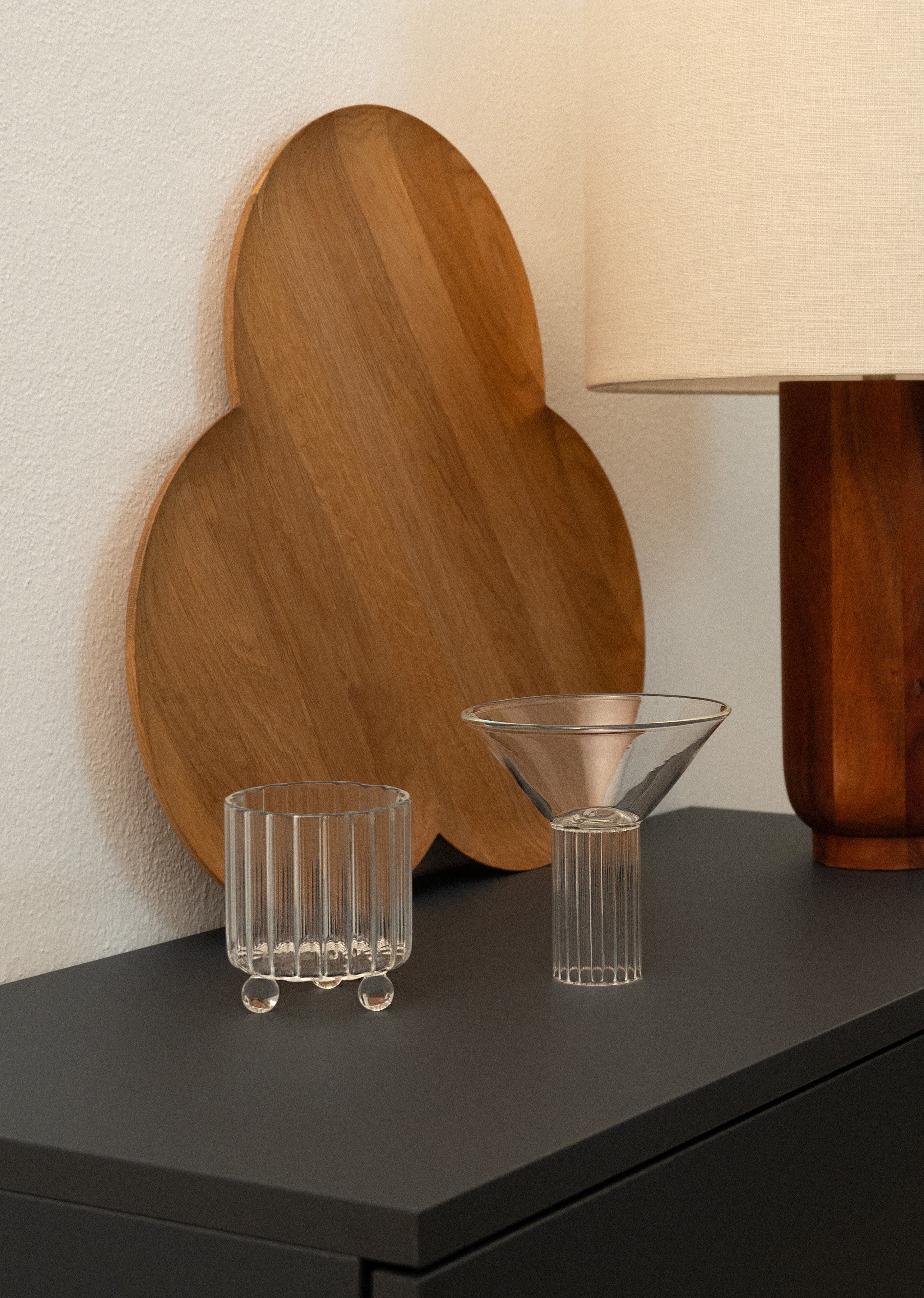 High Spirits — Lowball Glass Clear — side view on dark dresser with wooden tray