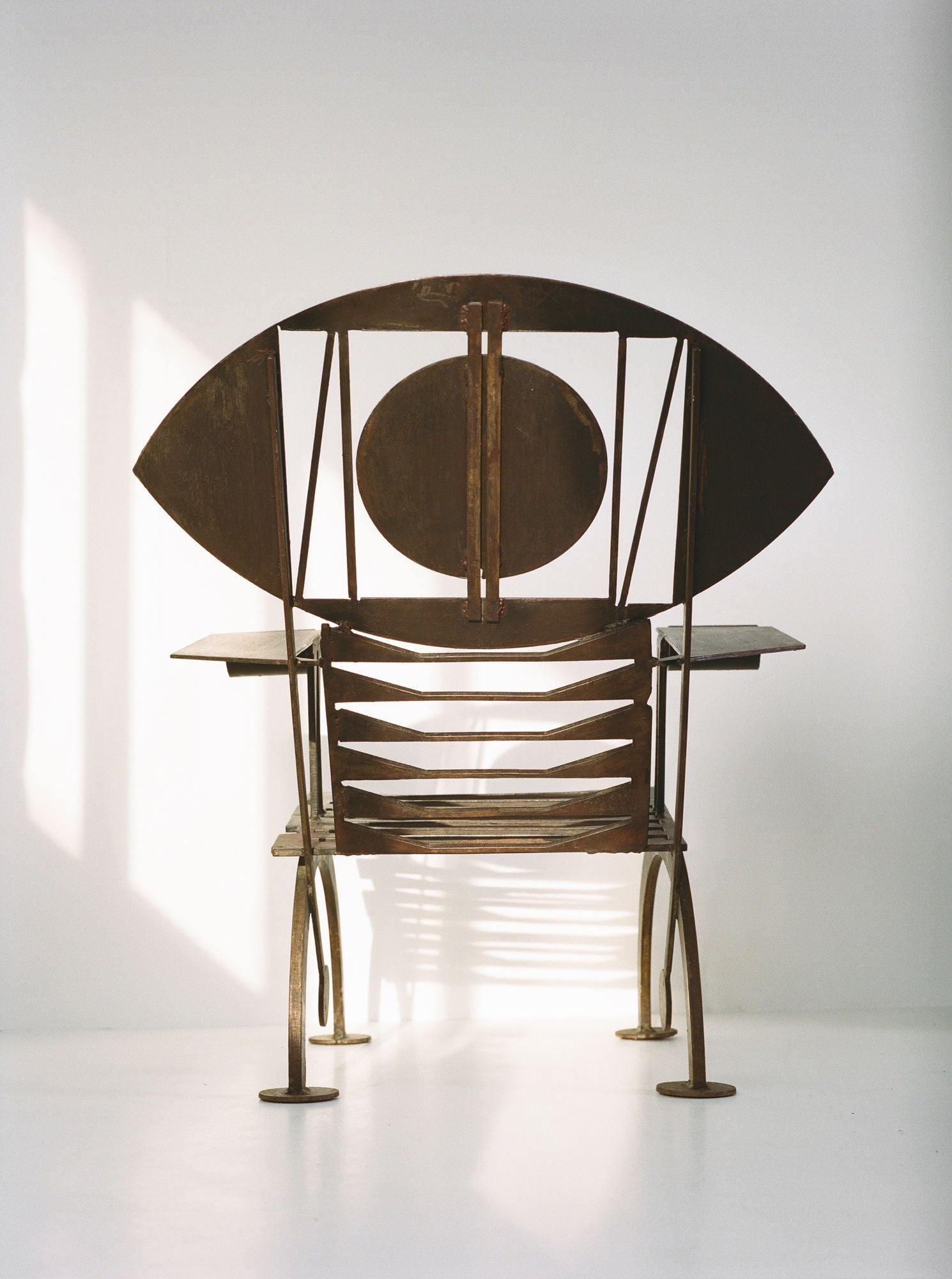 Functional Sculpture / Vintage Artist Arm Chair from Nigeria C. 1960-70 — back view highlighting metal design and shape