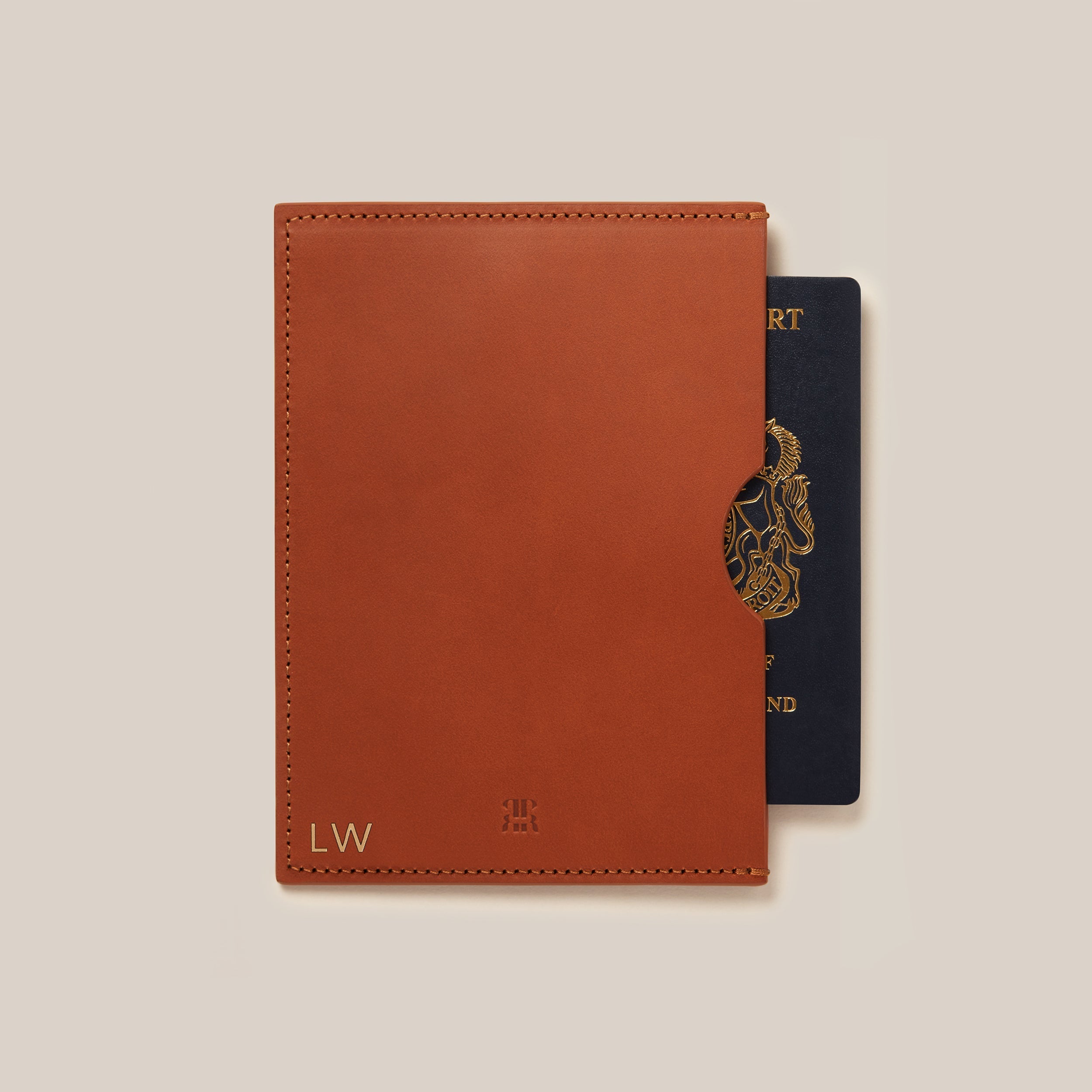 Leather Passport Holder — close-up of tan leather with passport peeking out